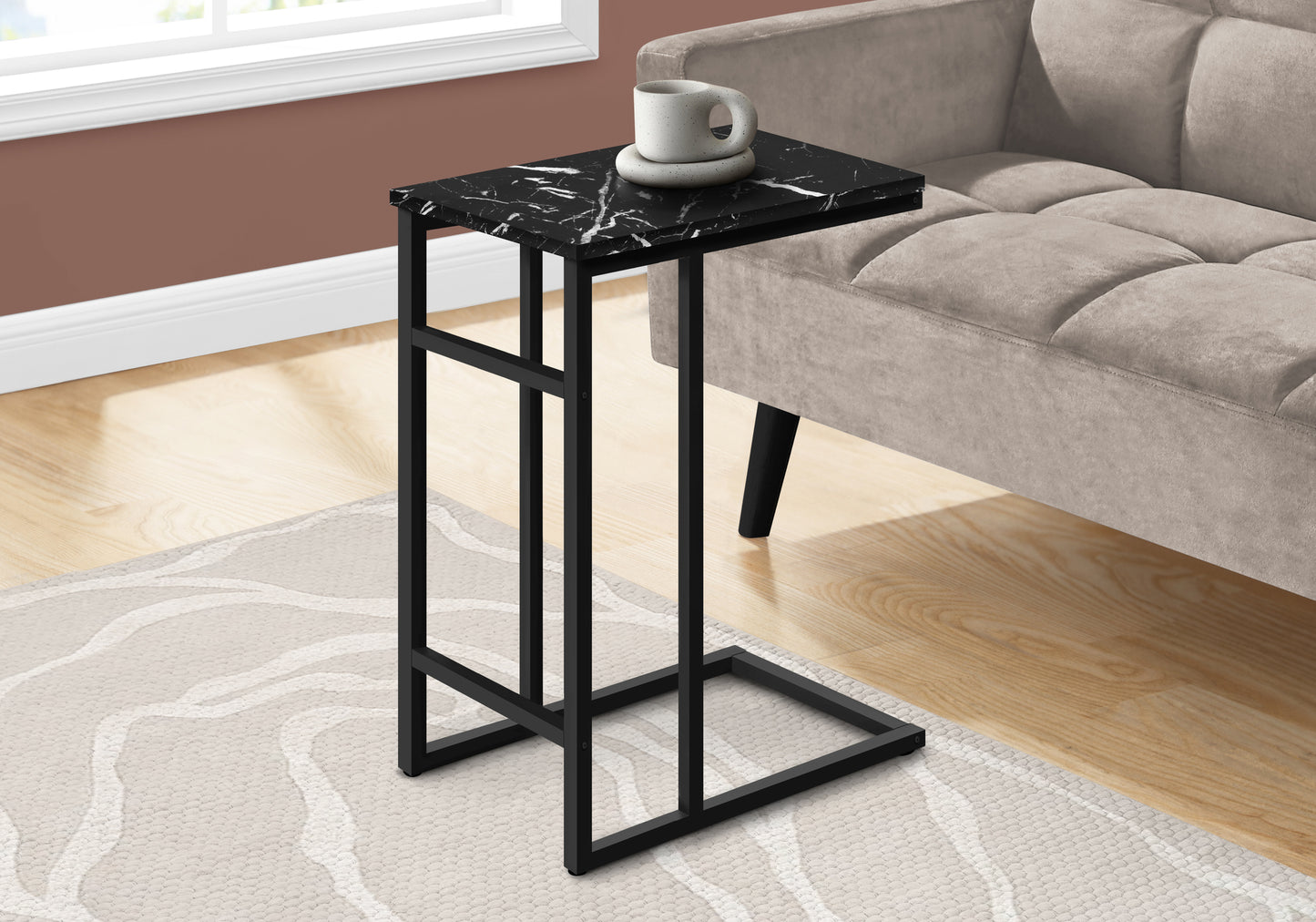 Black marble Ctable with a modern black metal frame perfect for living rooms