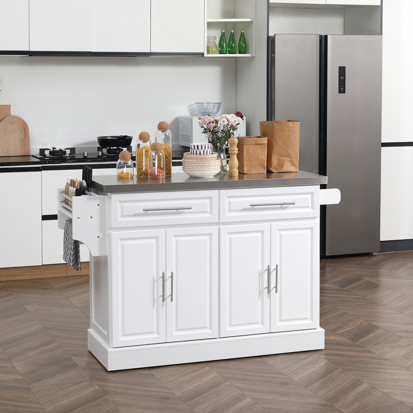 White kitchen island with stainless steel top and storage