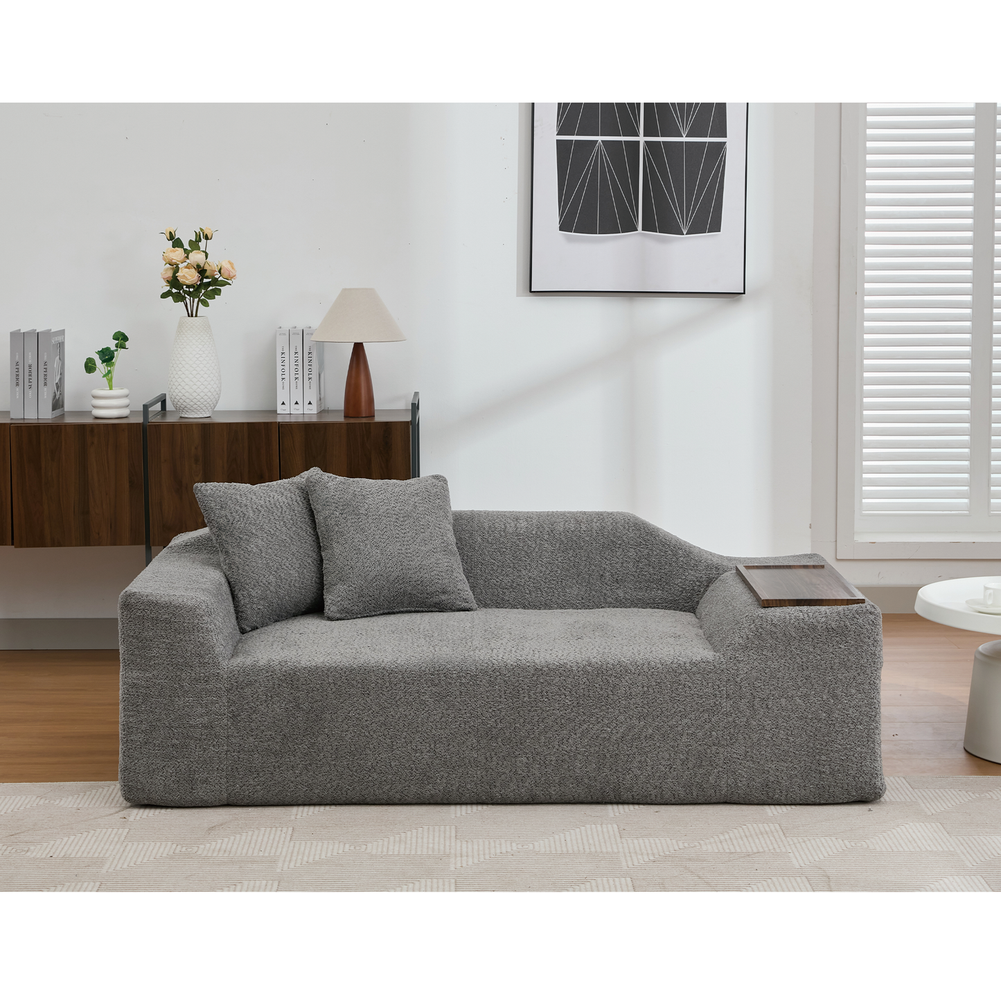 Grey textured fabric chaise lounge sofa with detachable tray and two matching cushions