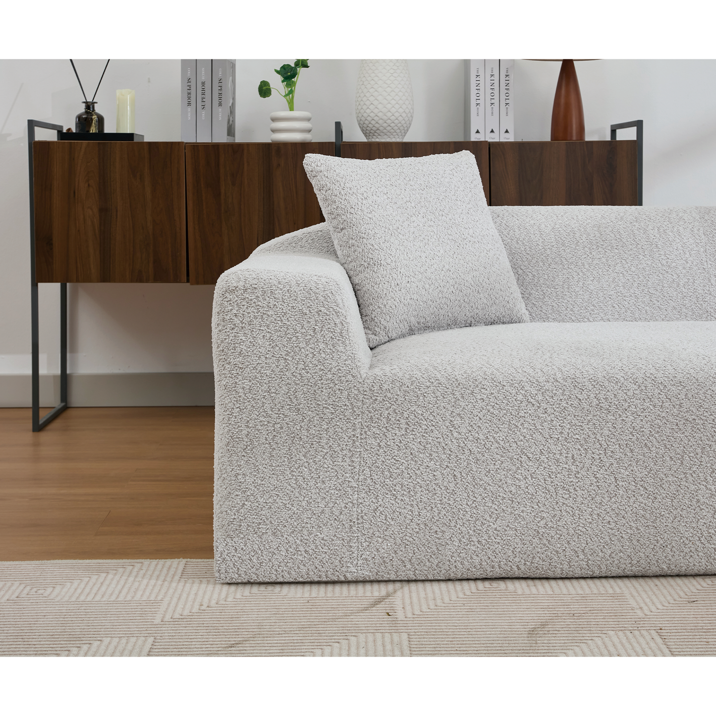 Textured boucle fabric armchair in light grey perfect for modern living rooms