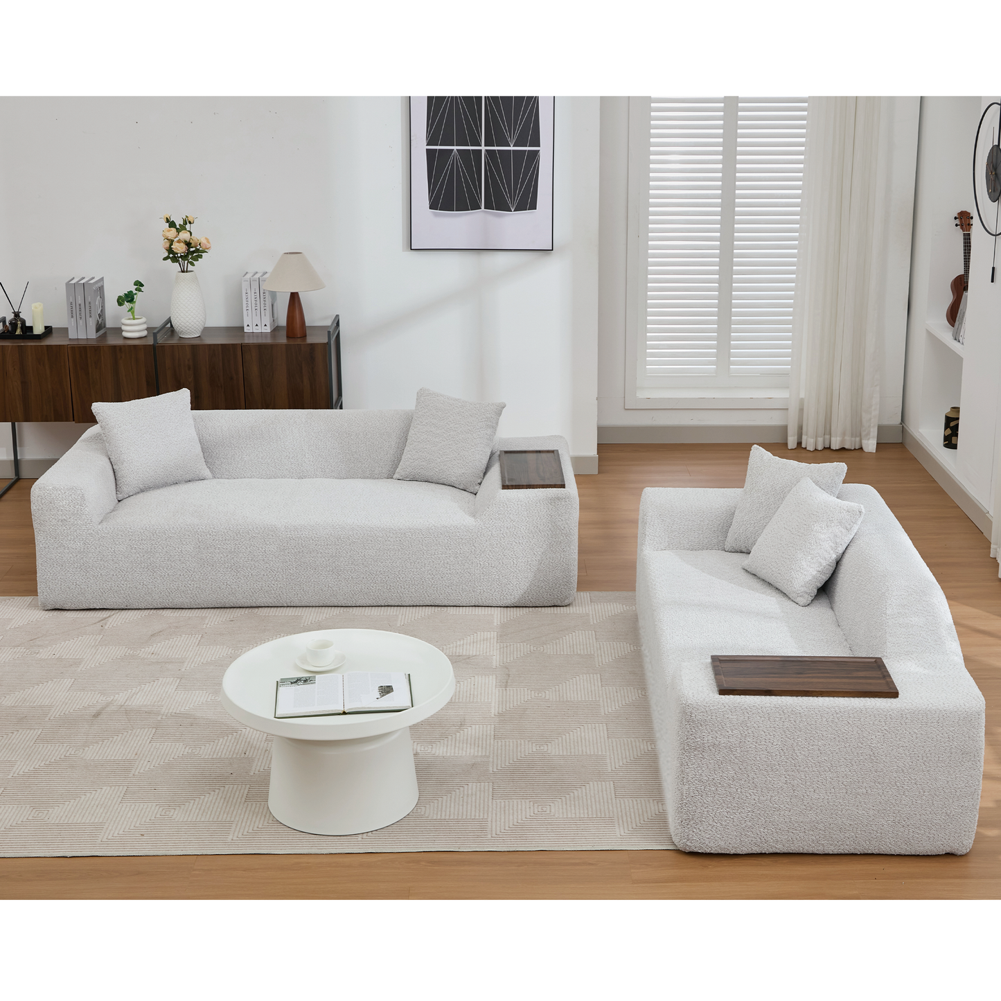 Plush light gray boucle sectional sofa with integrated wood tray and accent pillows