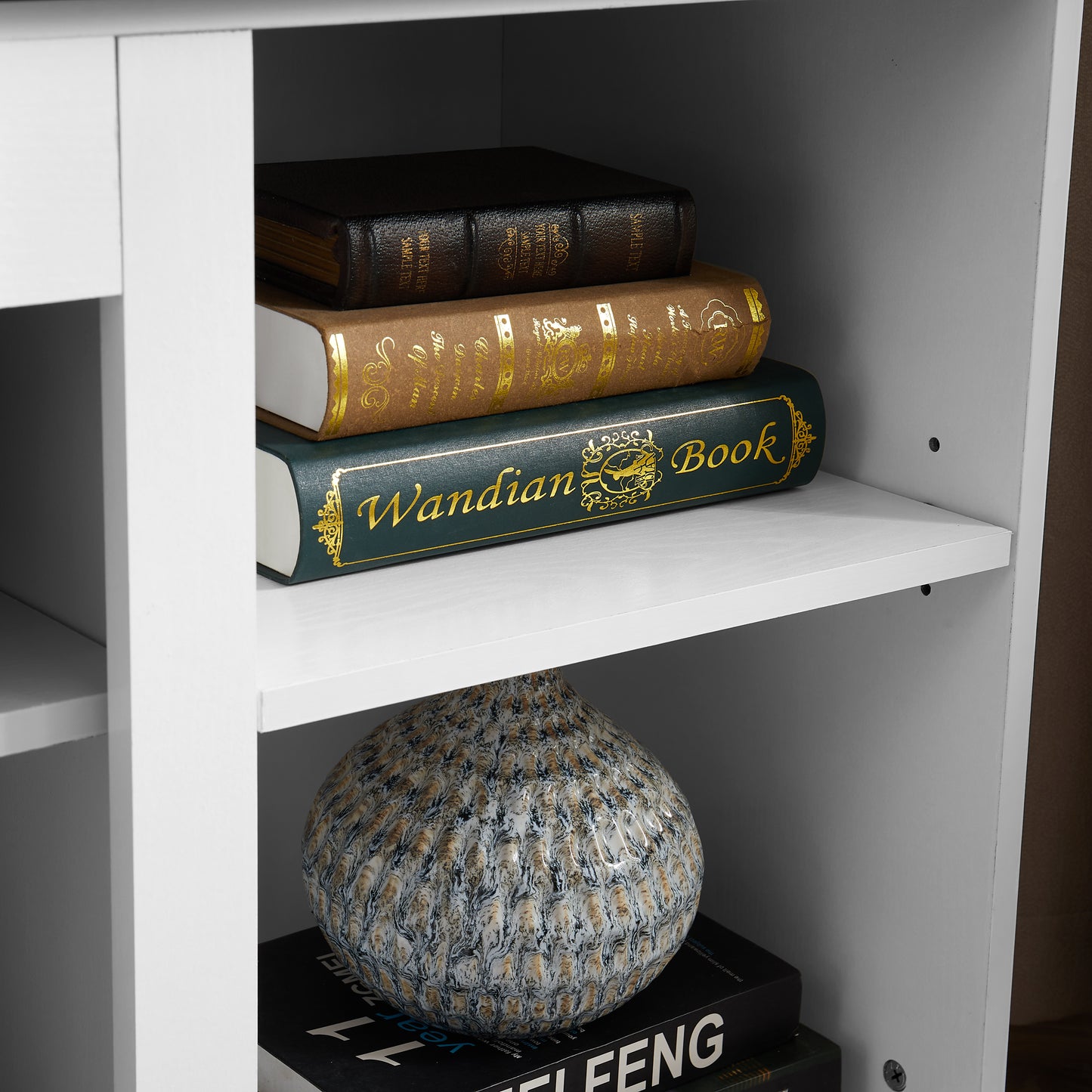 Dark brown leather book with gold embossed title ideal for desk decor