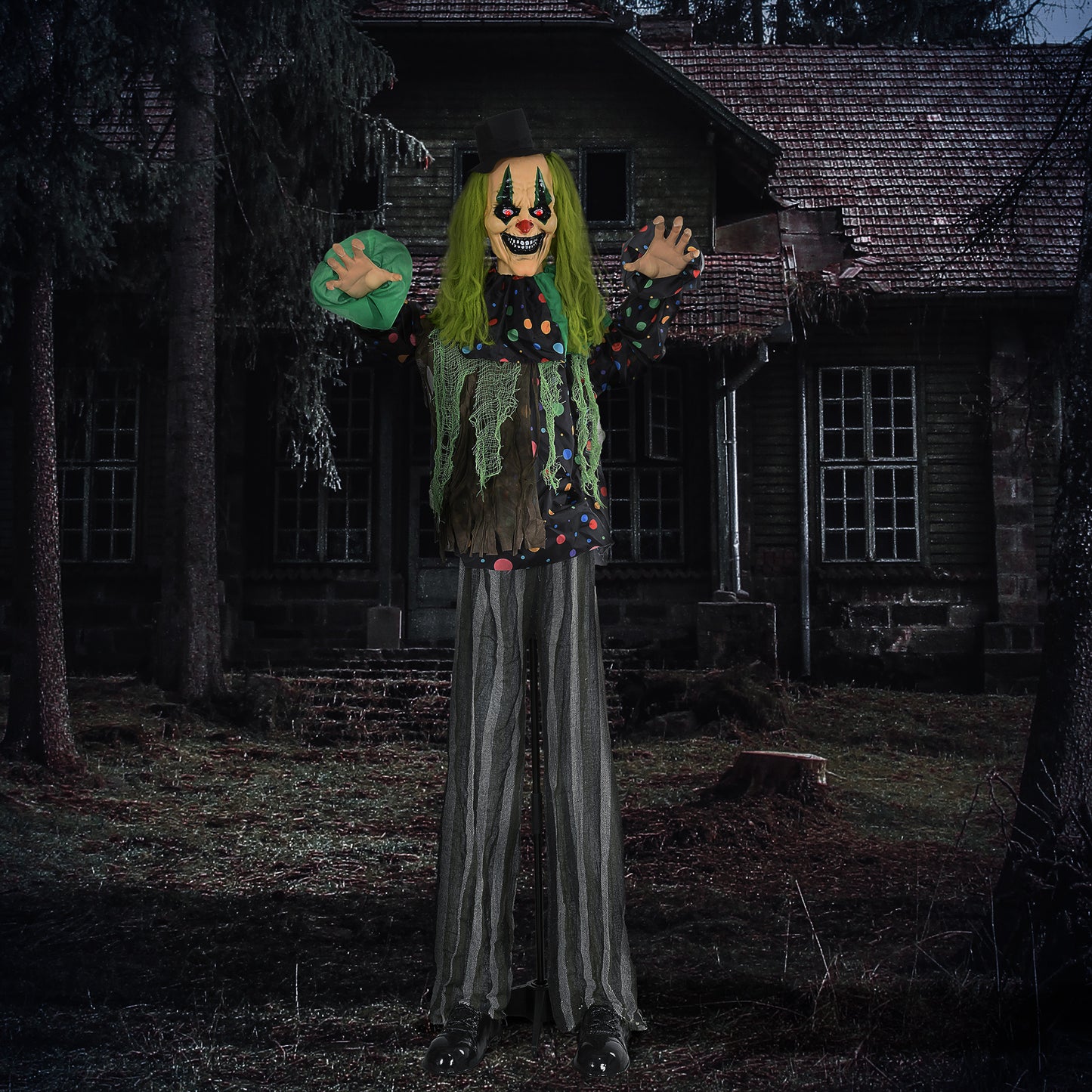 Scary greenhaired clown prop with polka dot shirt and striped pants