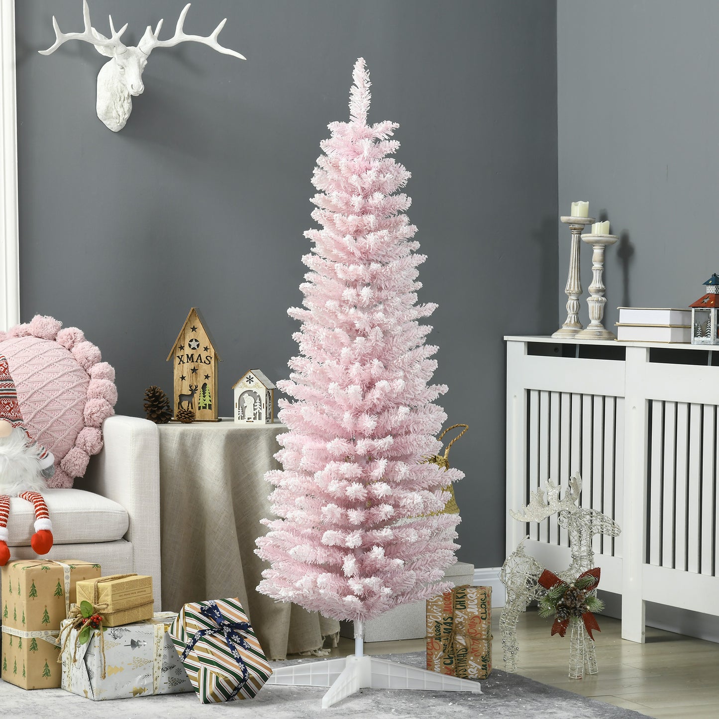Fluffy pink artificial Christmas tree with white tipped branches for festive decor