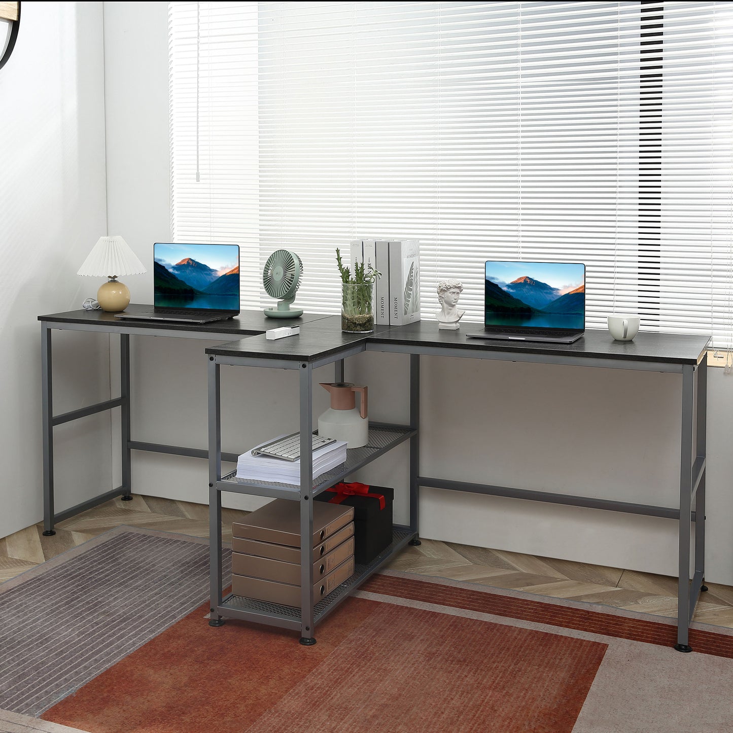 Black lshaped desk with metal frame two laptops and storage shelves for home office