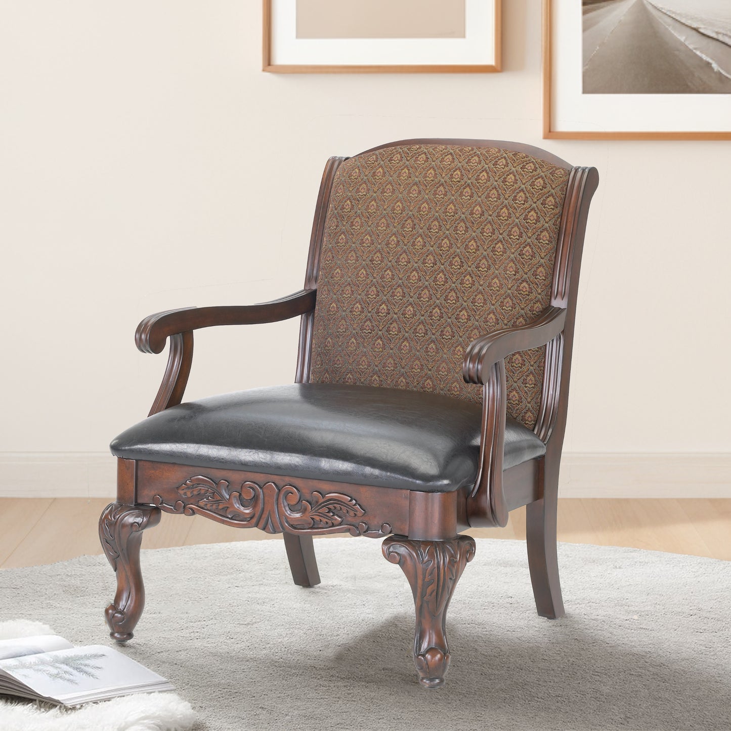 Dark wood accent chair with ornate patterned upholstery and a black leather seat