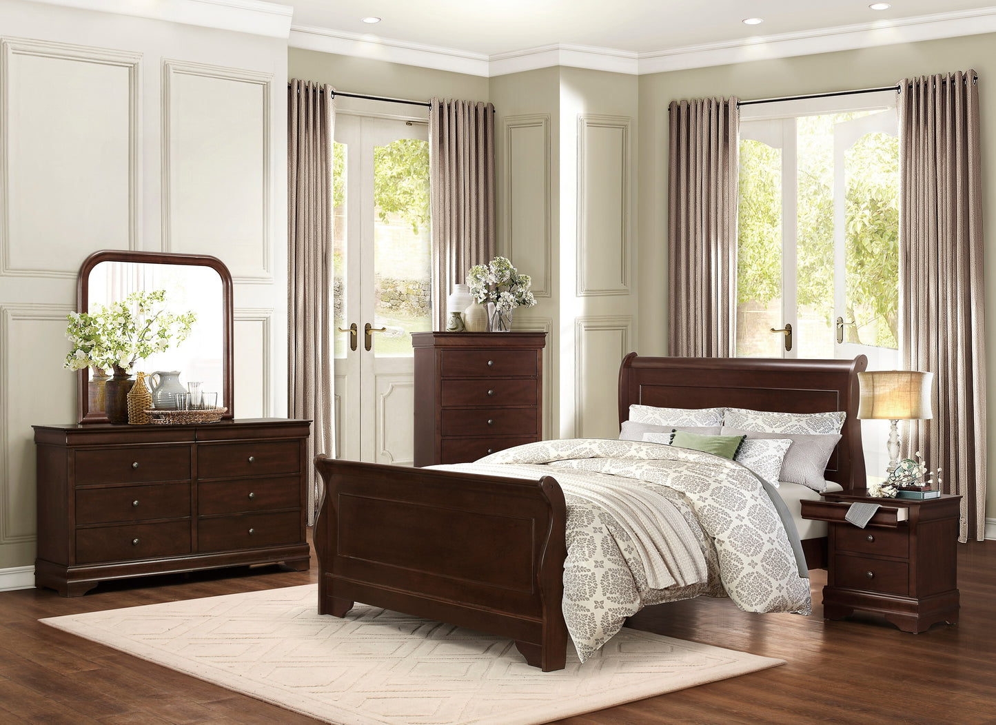 Dark wood sleigh bed with ornate carved headboard and footboard set in a bedroom
