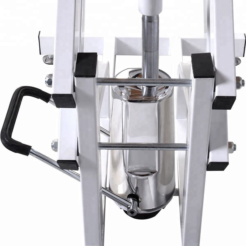 Closeup of a chrome and white hydraulic car jack with black grip handle
