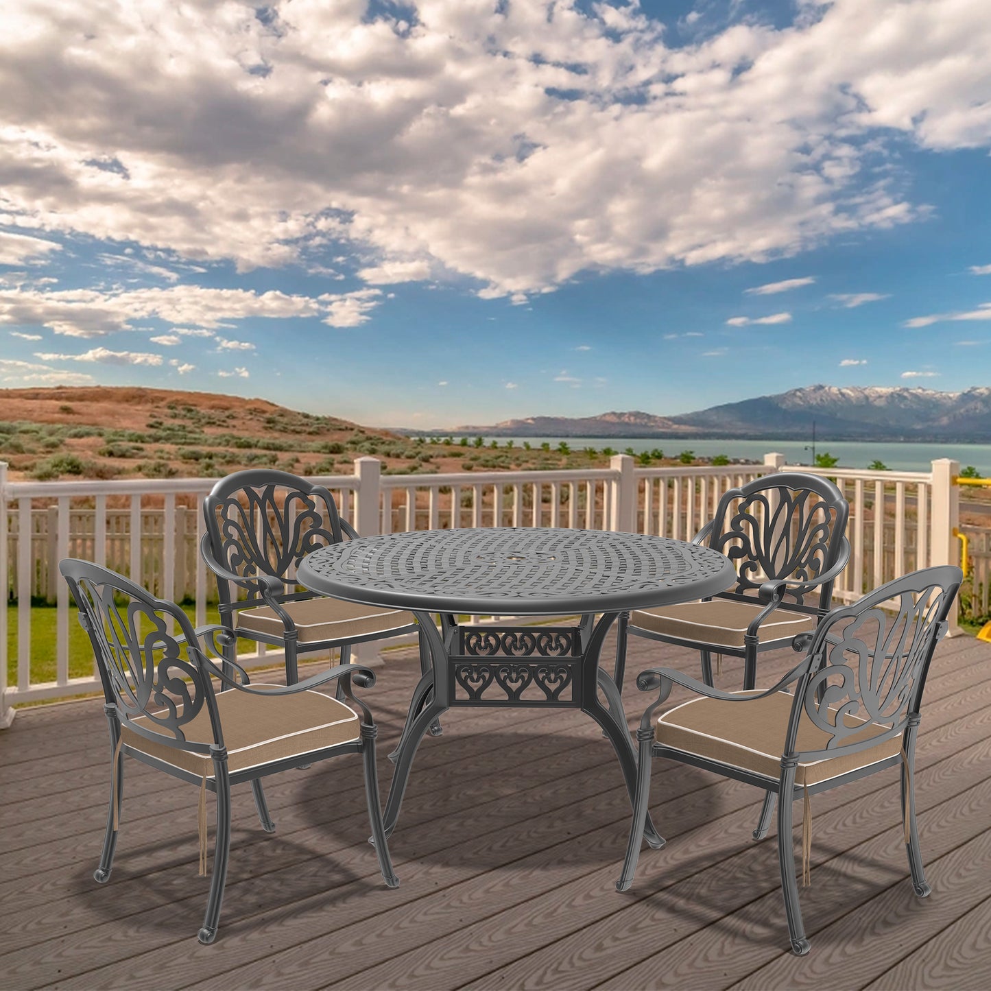 Ornate dark grey metal patio dining set with tan cushions ideal for outdoor entertaining