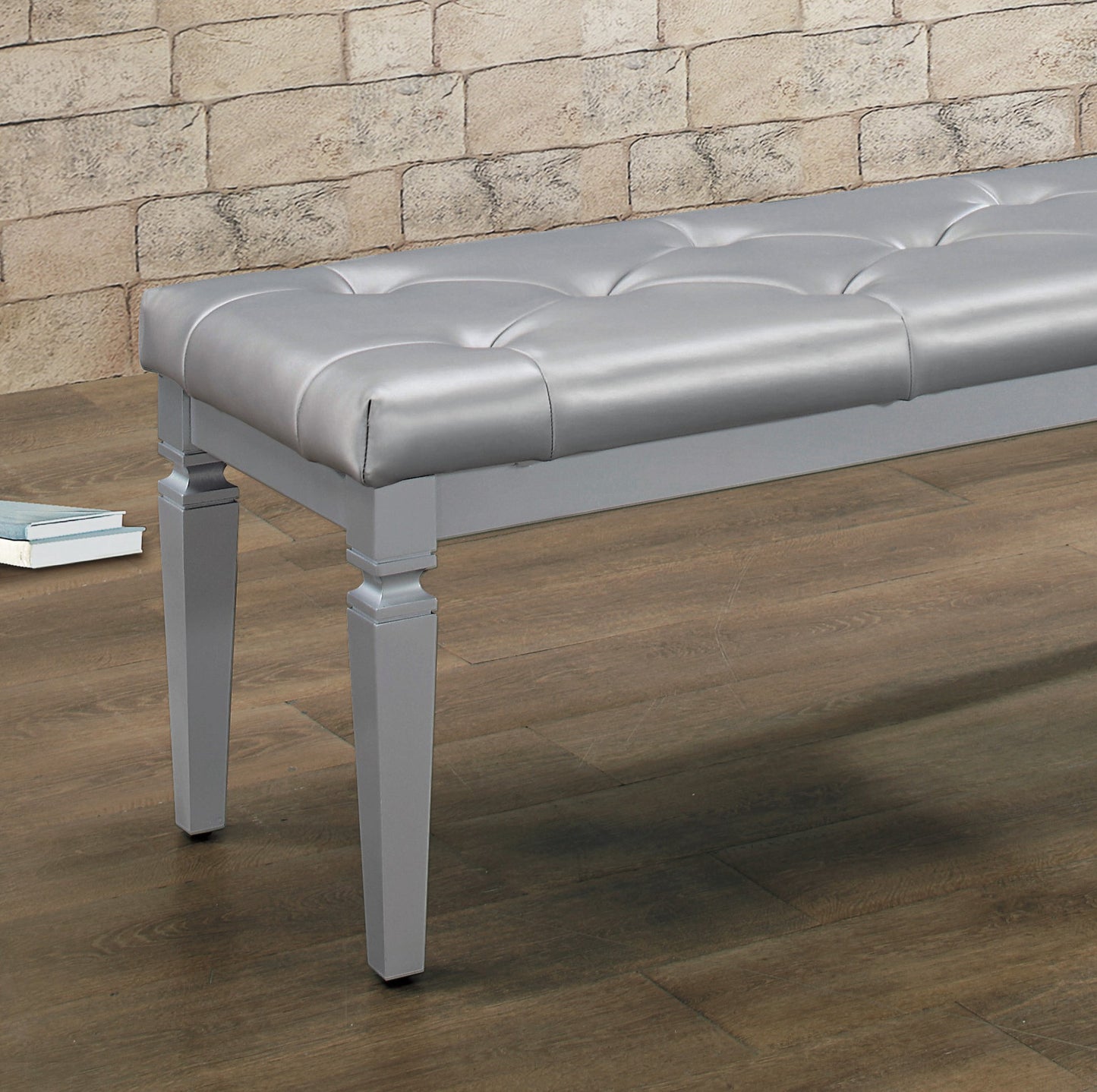 Silver faux leather tufted bench with grey wooden legs ideal for entryway seating