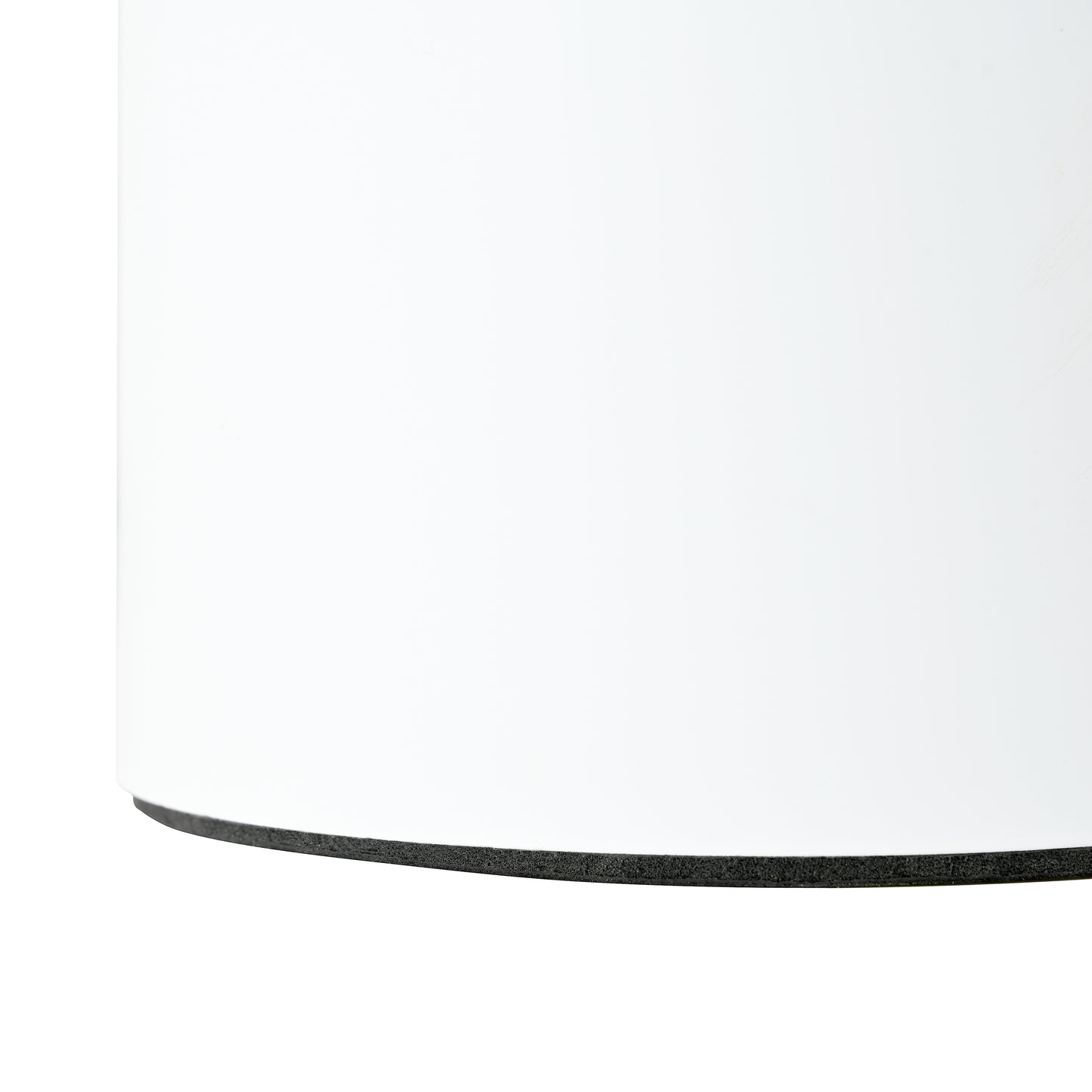 Closeup of a white cylinder base with black foam edge detail