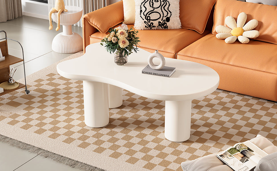 White organic shaped coffee table with rounded legs complementing a modern living room