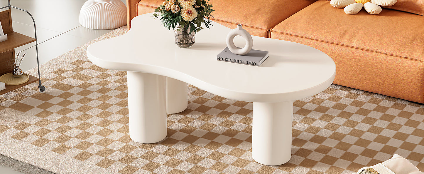 Curved offwhite coffee table with a modern organic design on a checkered rug