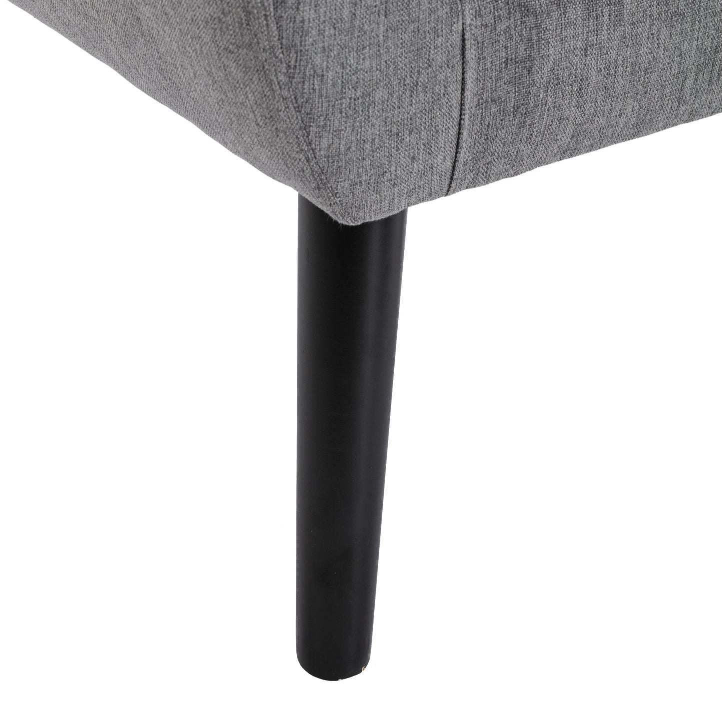 Closeup of a gray upholstered sofa leg with a black tapered wooden foot