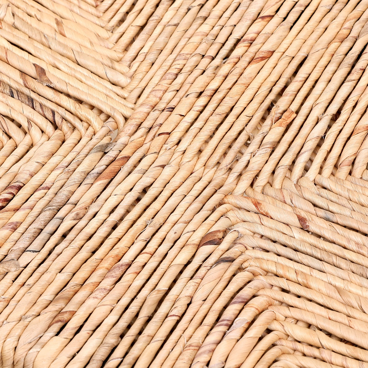 Closeup of woven natural jute rope forming a diamond pattern texture
