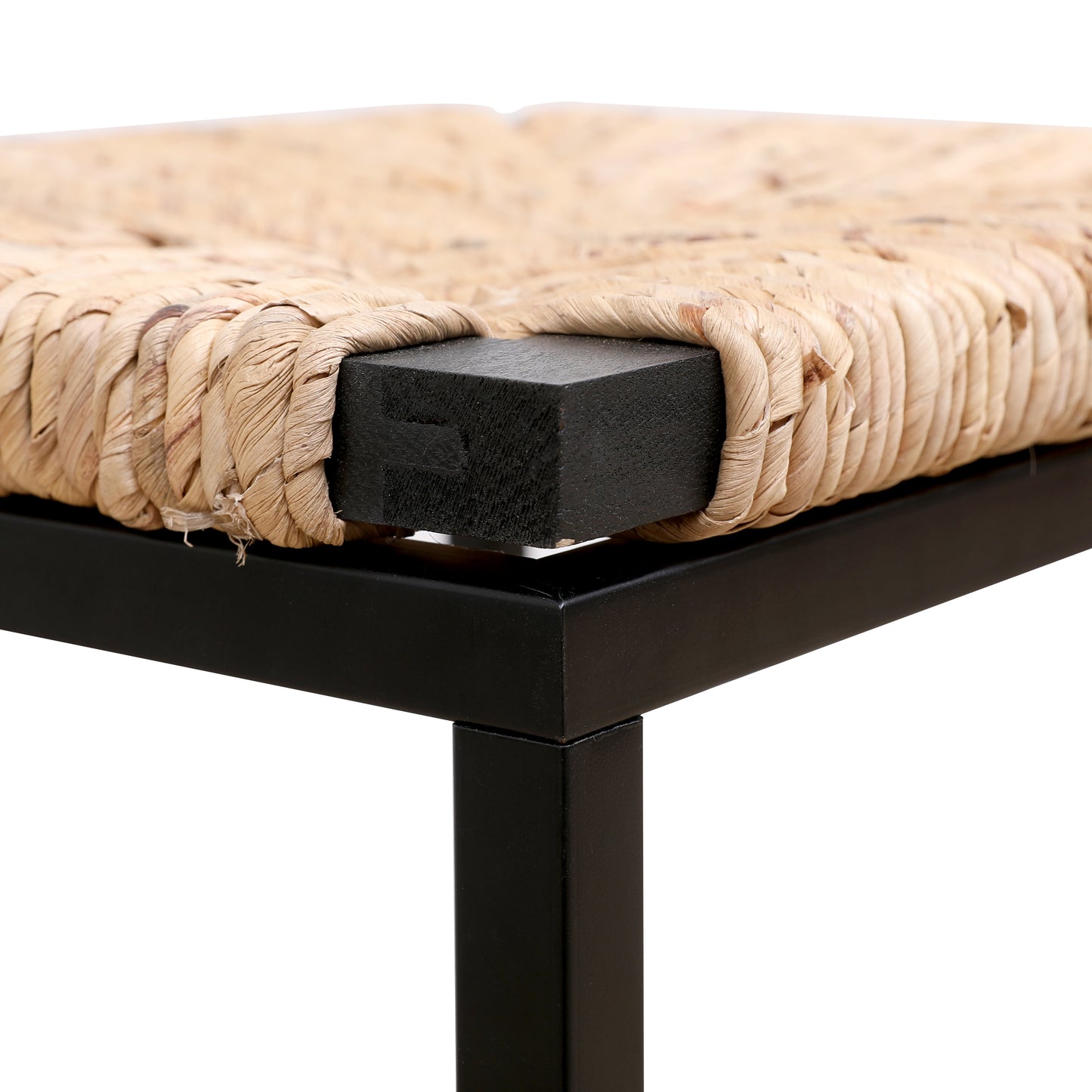 Closeup of a rustic woven raffia stool seat with black wooden corner support