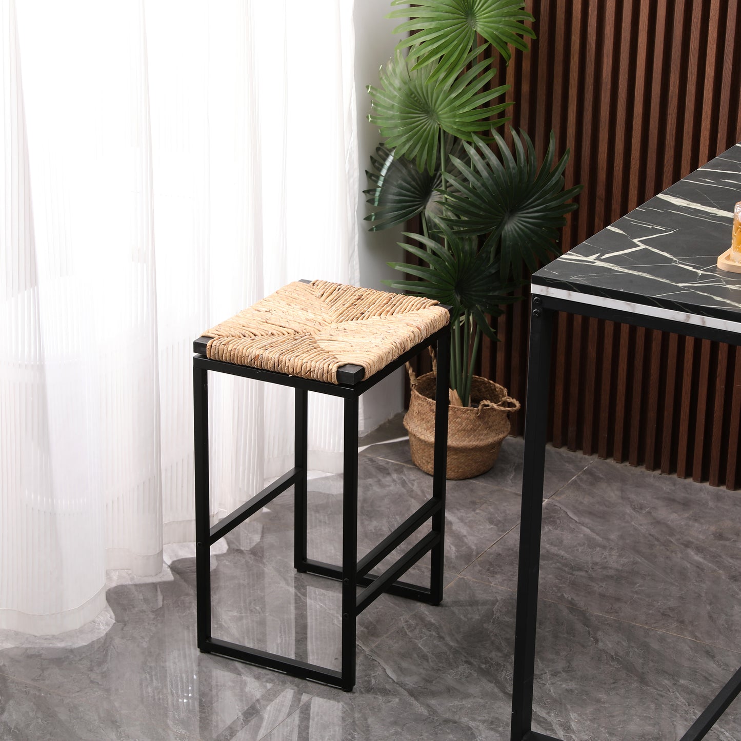 Woven natural seagrass seat bar stool with a black metal frame
