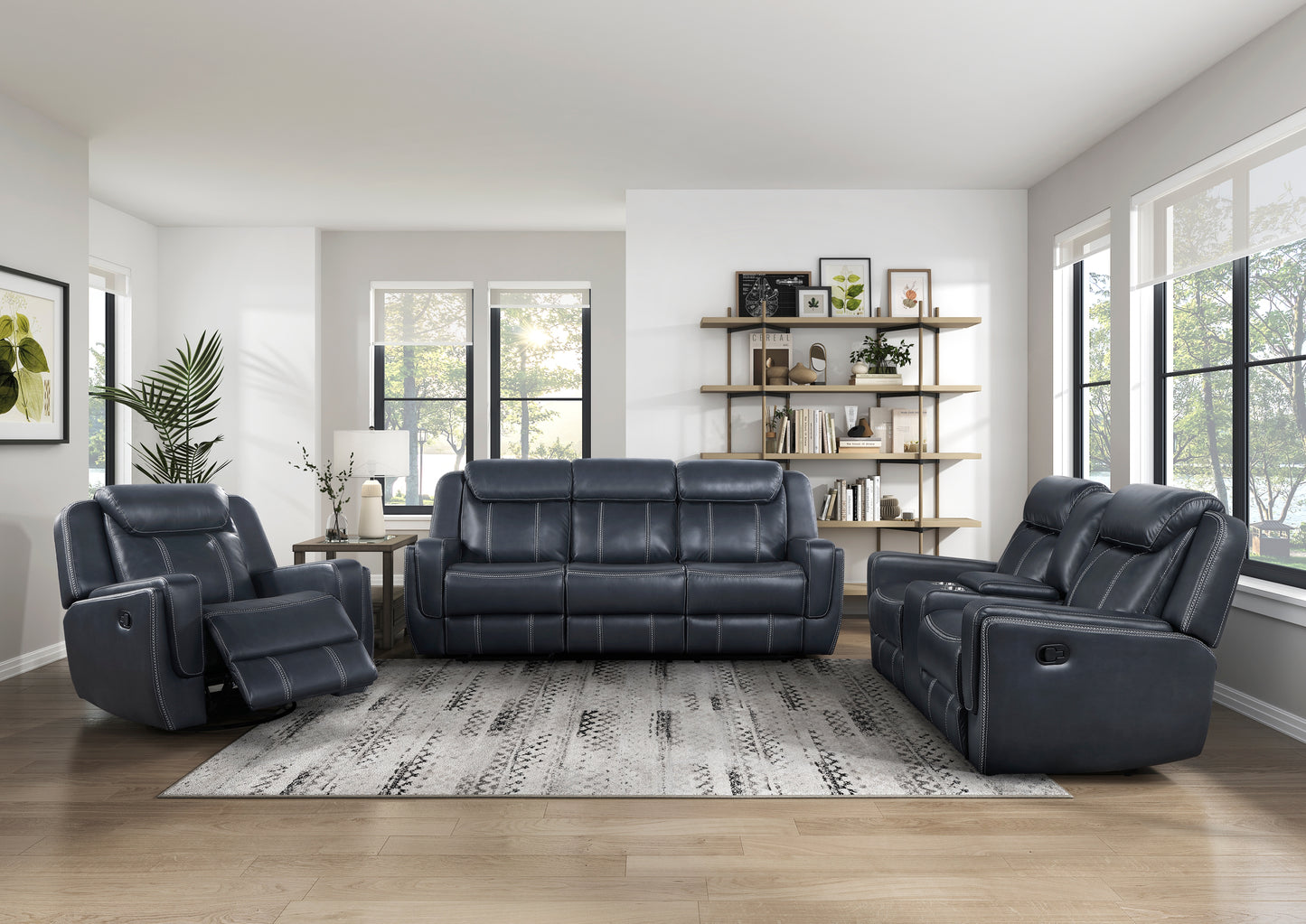 Dark navy leather reclining sofa with white stitching set in a modern living room