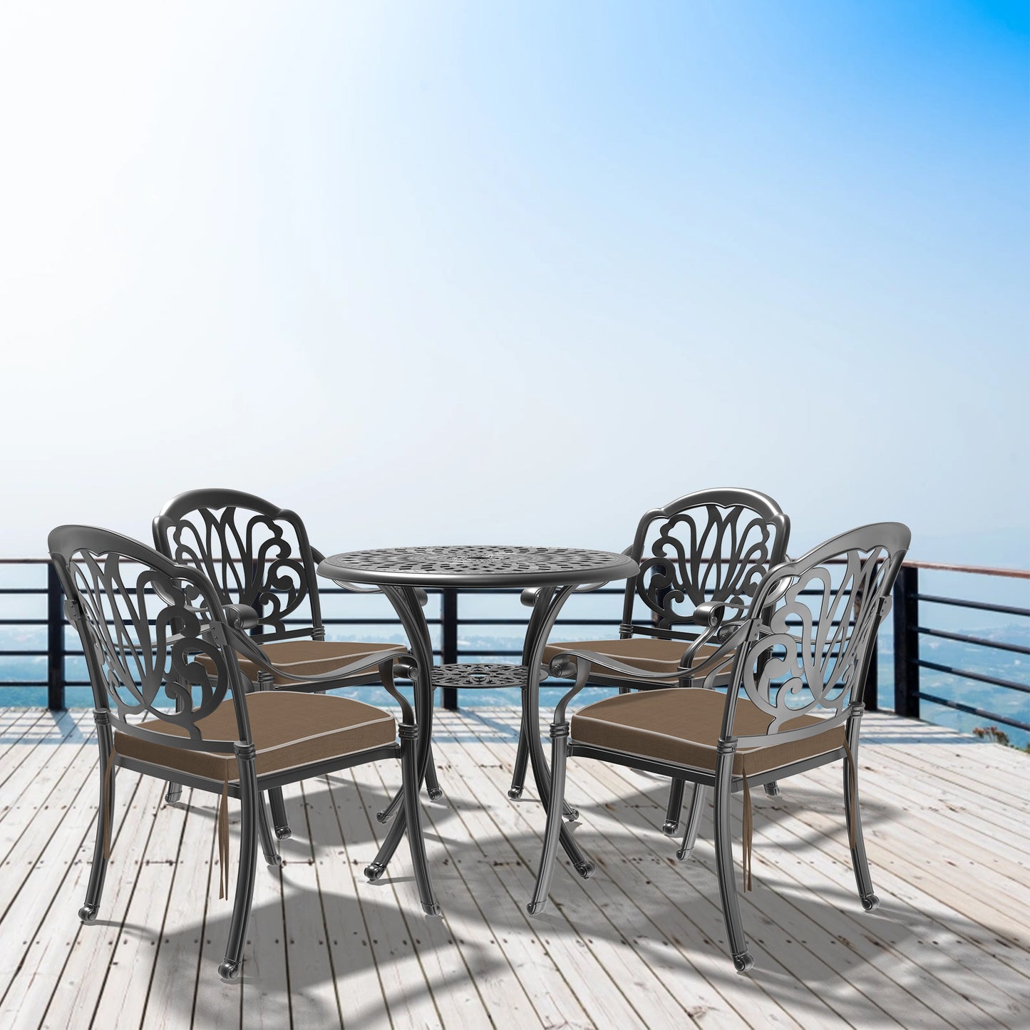 Ornate metal patio dining set with four chairs and round table