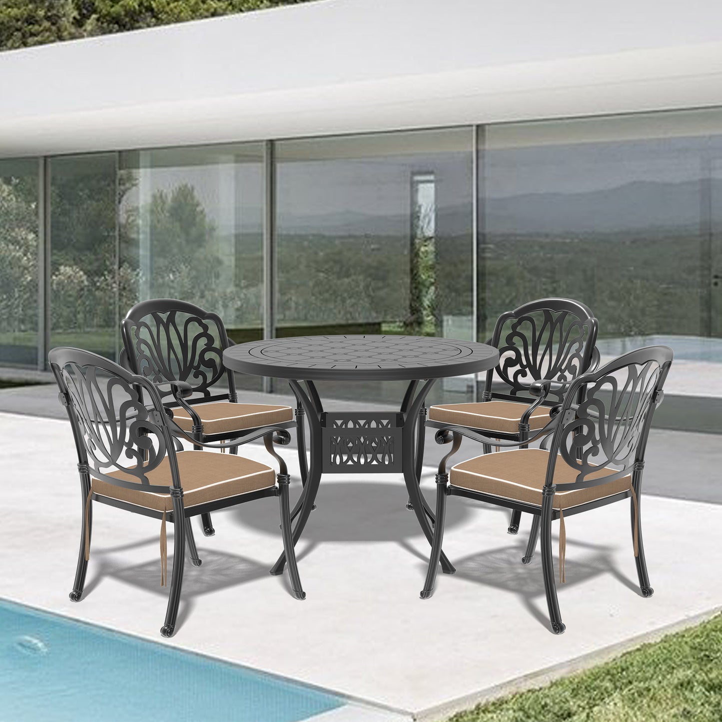 Black cast aluminum patio dining set with ornate chairs and round table