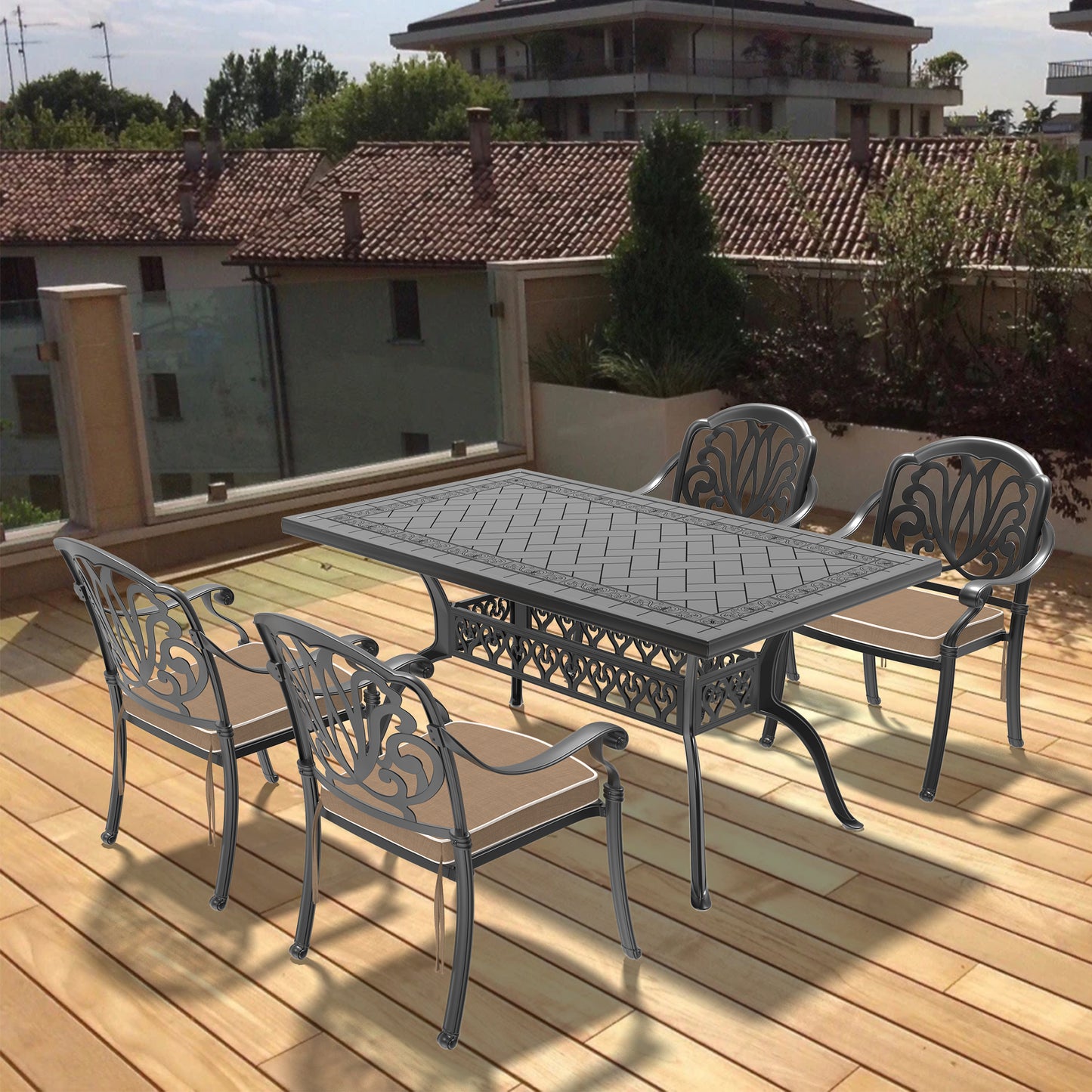 Ornate cast aluminum patio dining set with rectangular table and four chairs