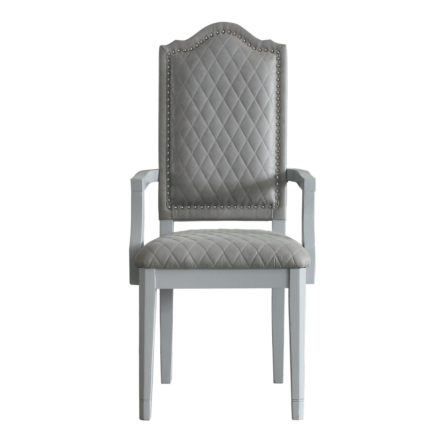 Grey upholstered armchair with tufted back and studded trim perfect for dining rooms