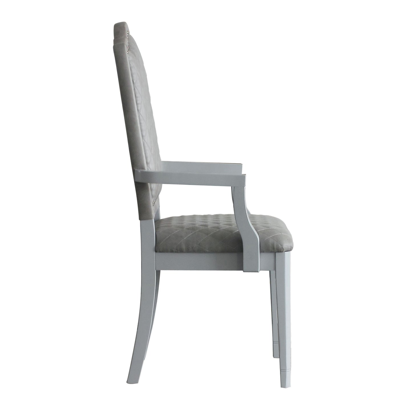 Grey upholstered dining chair with tufted seat and back and elegant carved legs