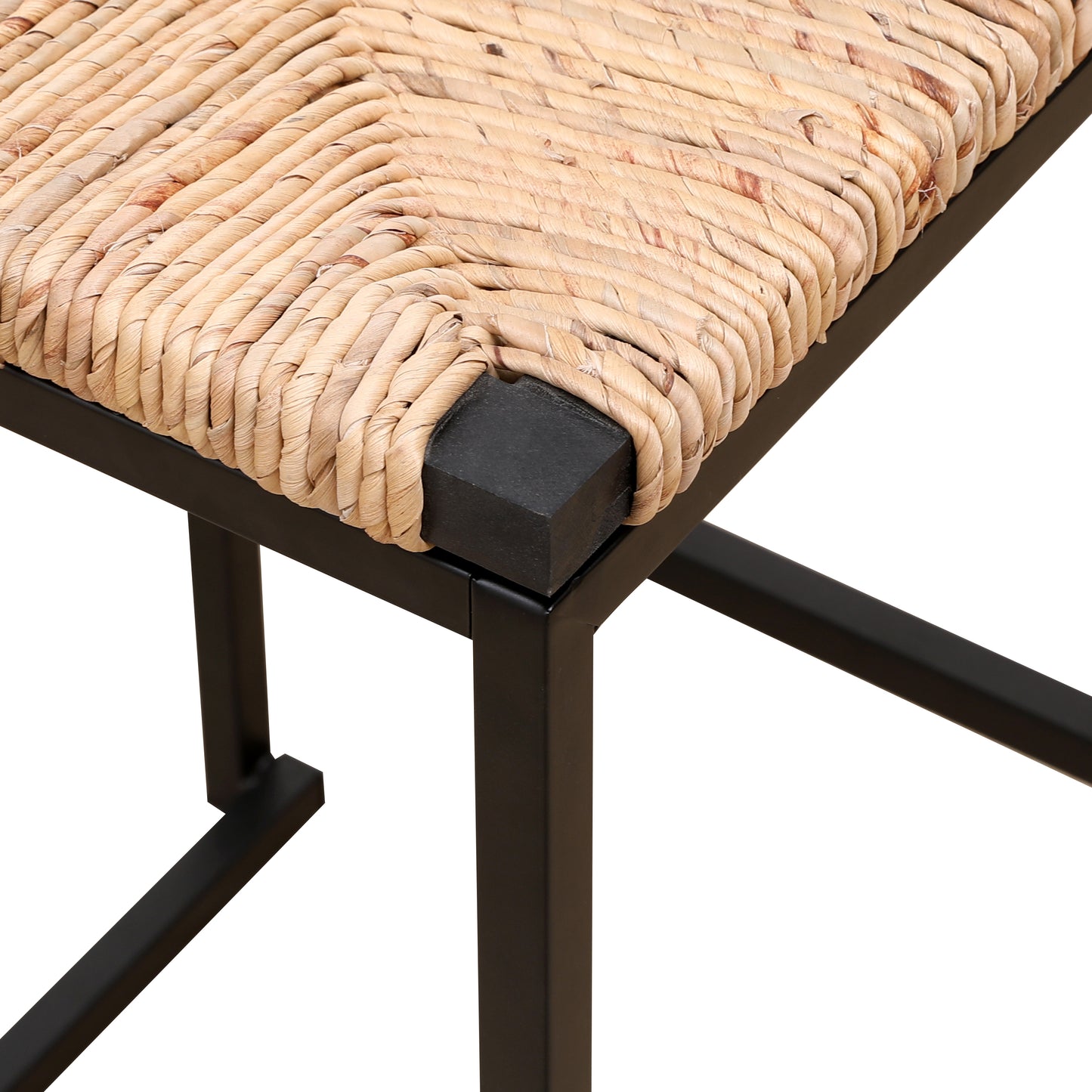 Closeup of a natural woven hyacinth stool seat with a black metal frame
