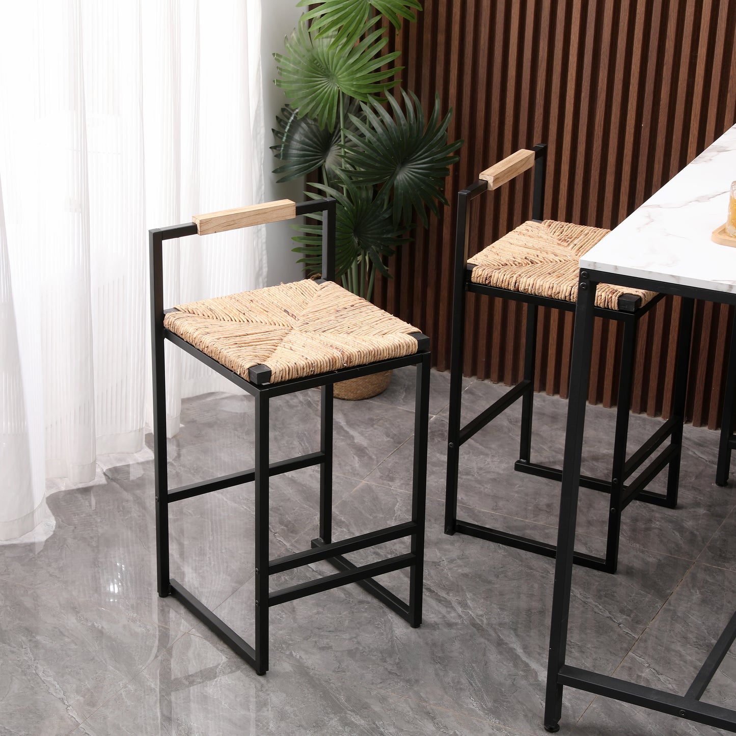 Modern black metal bar stool with woven natural seagrass seat and light wood arms