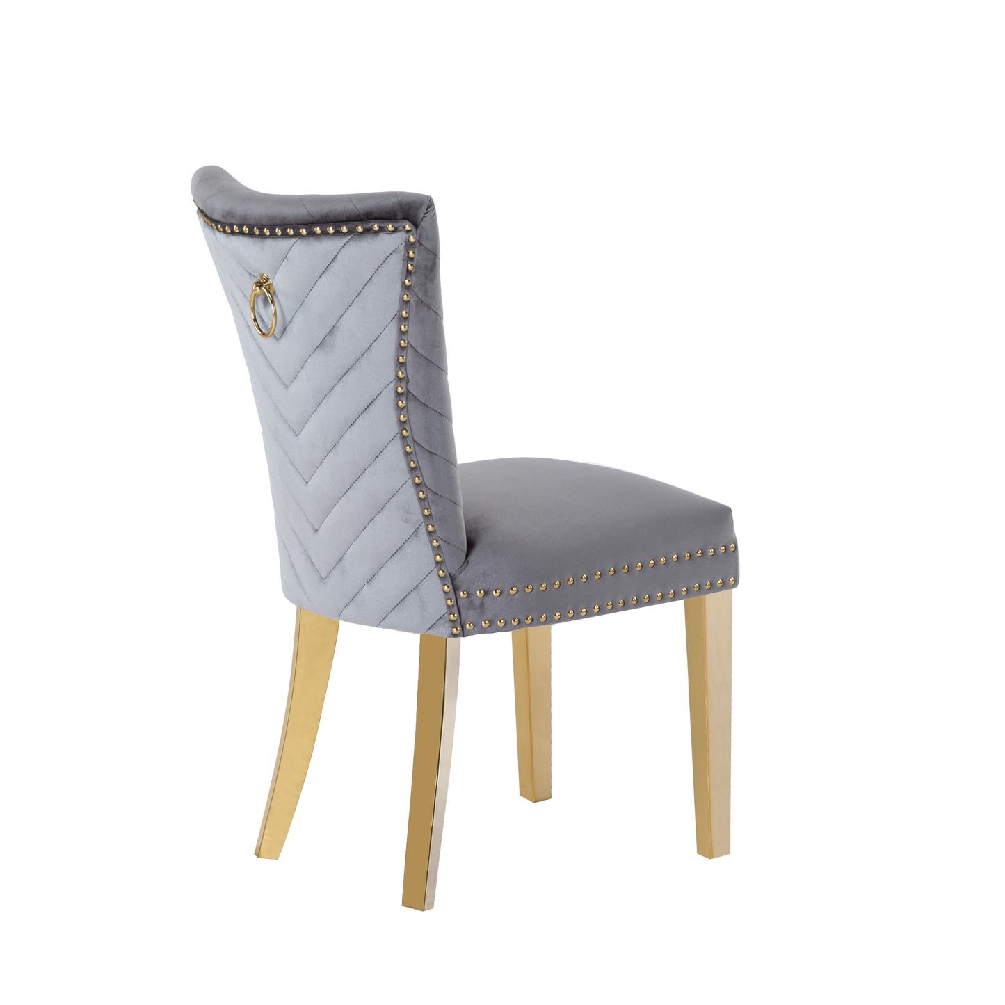 Light gray velvet dining chair with gold ring pull and brass legs tufted back