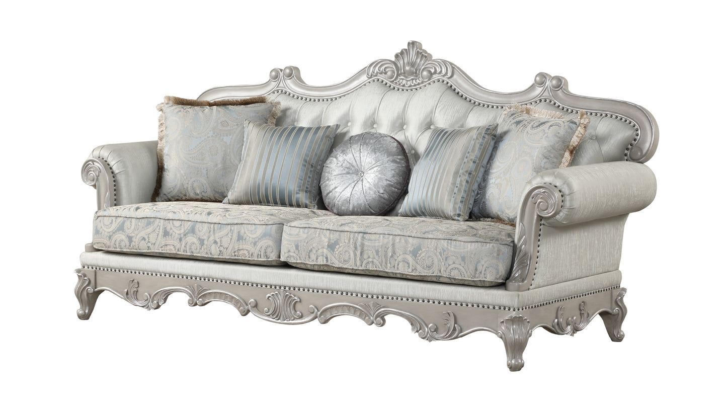 Elegant silver ornate sofa with plush blue and silver paisley cushions for living room decor