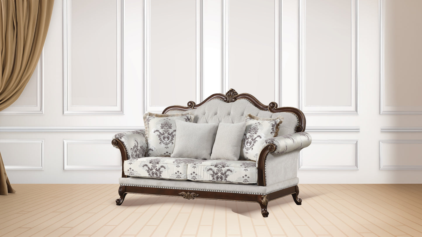 Ornate fabric loveseat with tufted back and scrolled wooden frame