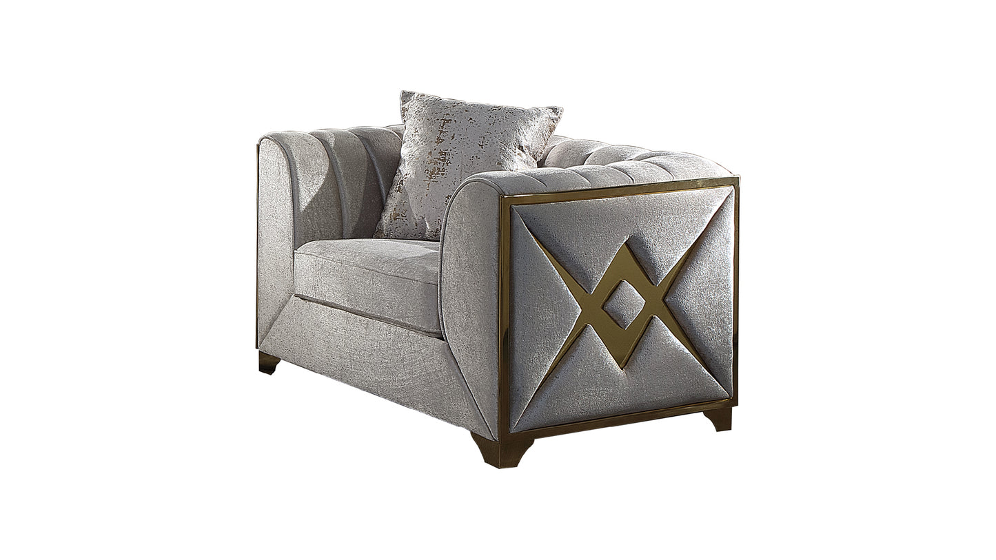 Elegant silver armchair with plush upholstery and gold geometric accents