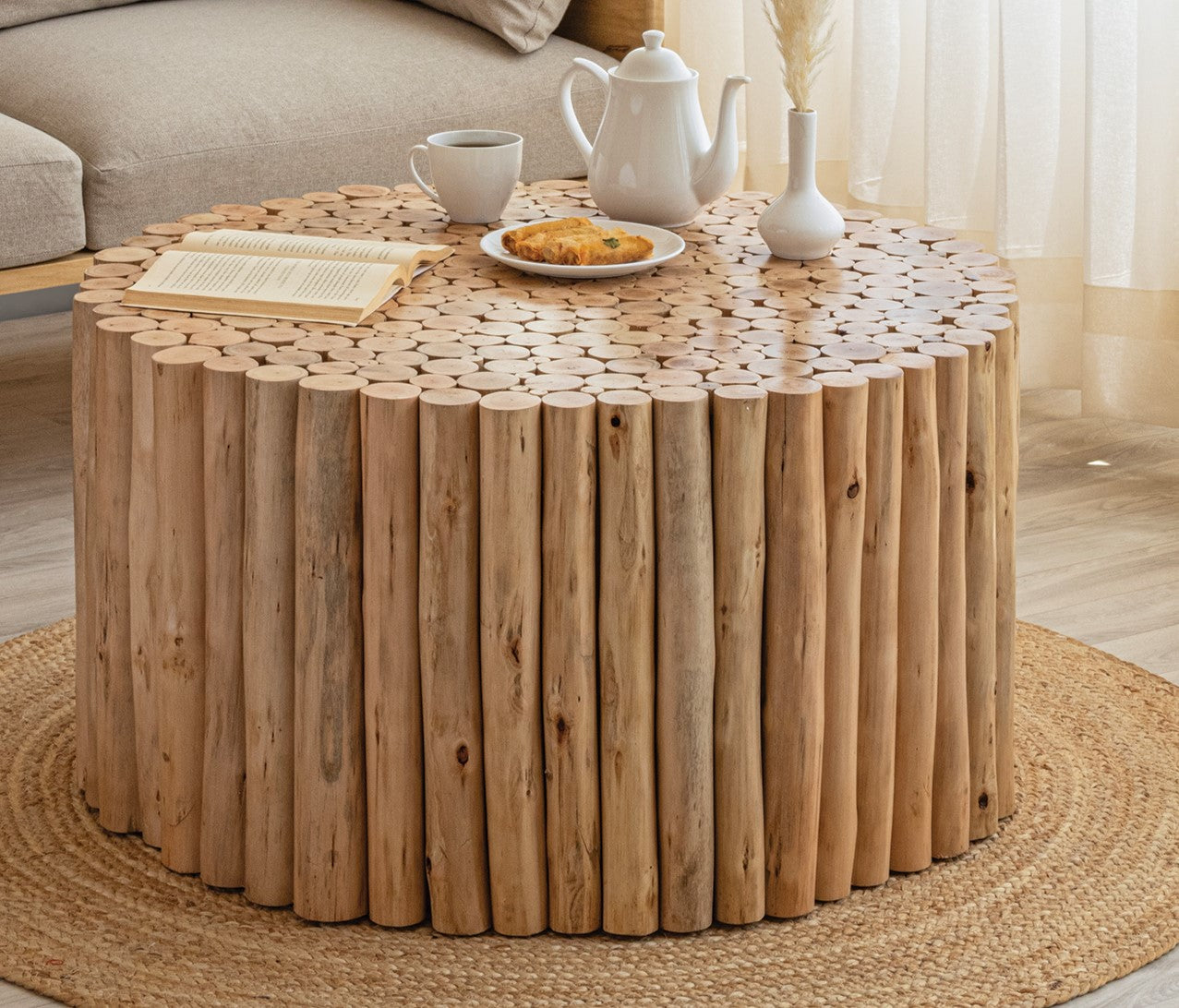 Rustic round coffee table made of natural wood logs perfect for living room decor