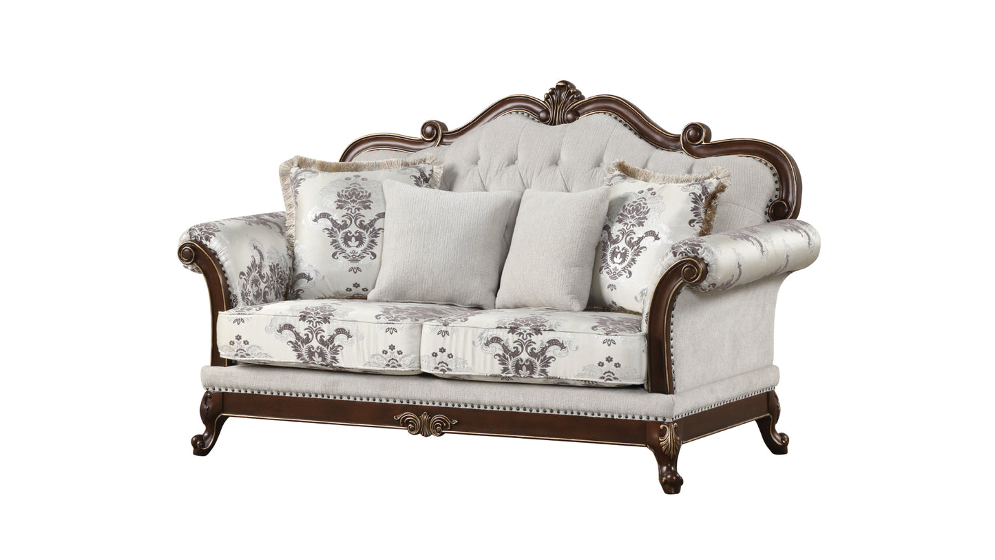 Elegant tufted loveseat with damask pattern upholstery and carved wooden frame