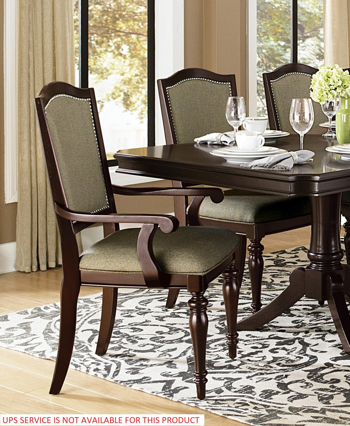 Dark wood dining chair with upholstered green seat and back classic design