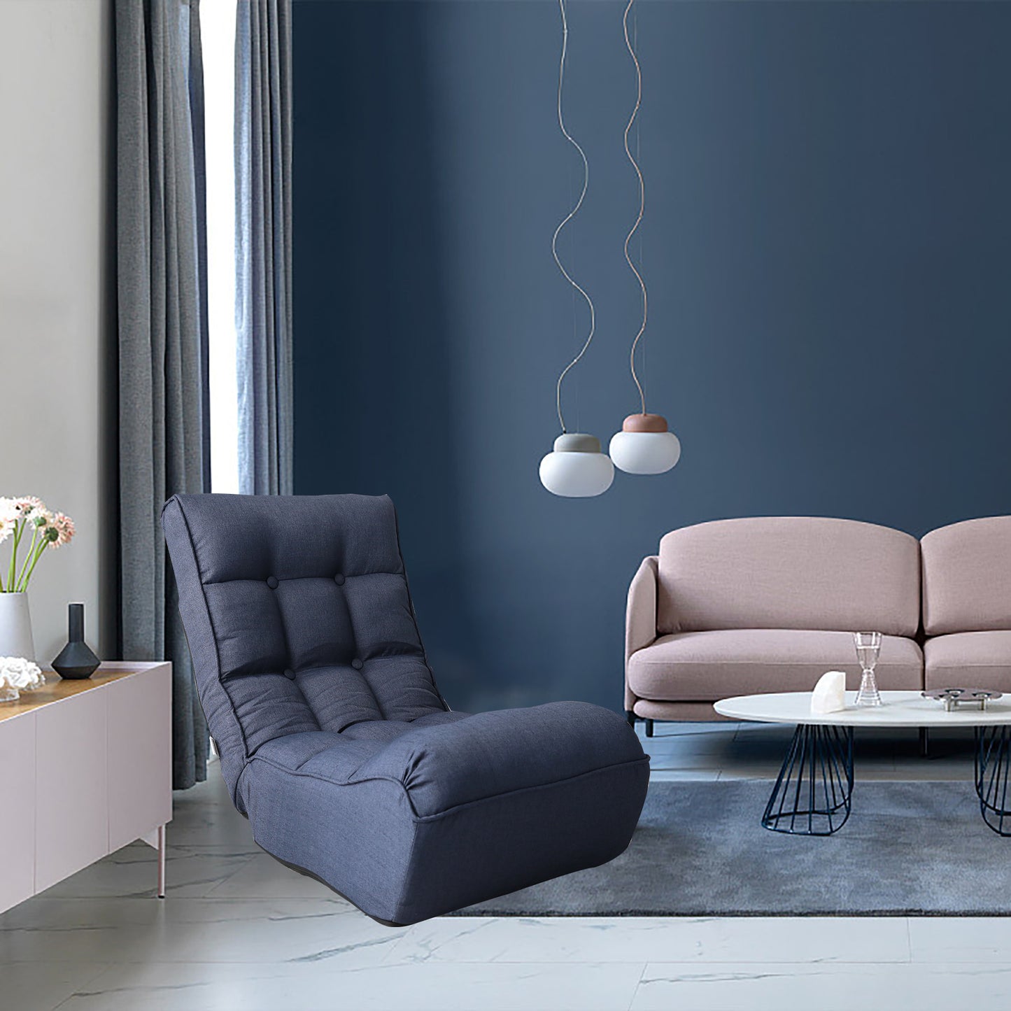 Dark grey tufted lounge chair with adjustable back perfect for cozy reading nooks