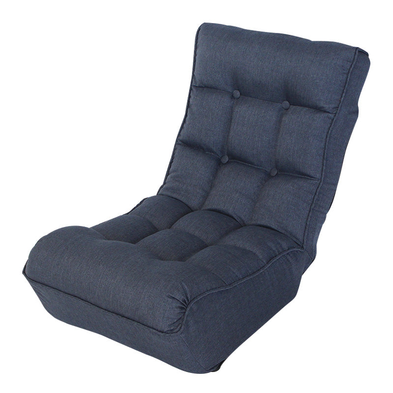 Dark blue tufted floor chair with adjustable backrest for gaming
