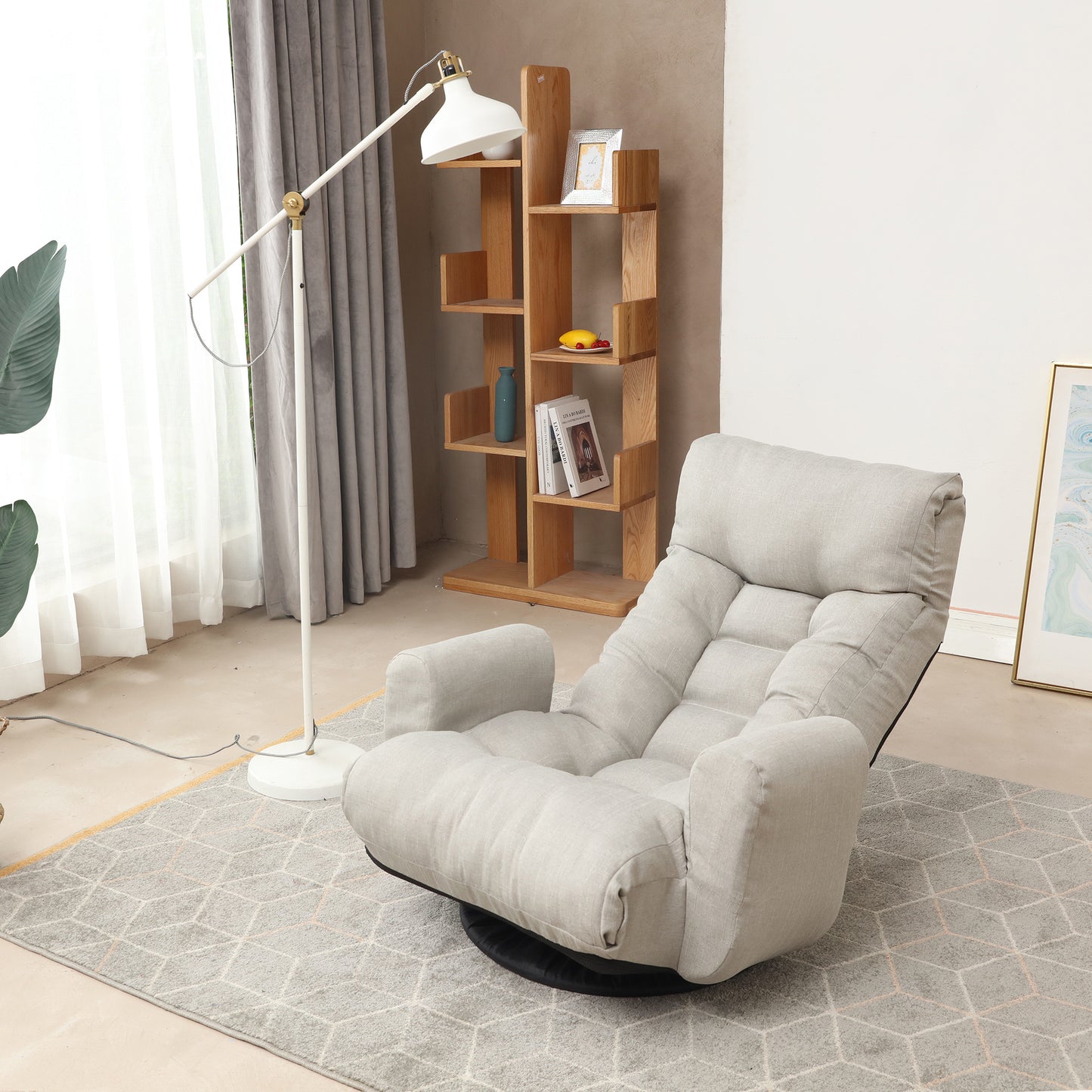 Comfortable light gray linen swivel chair with plush cushions and armrests