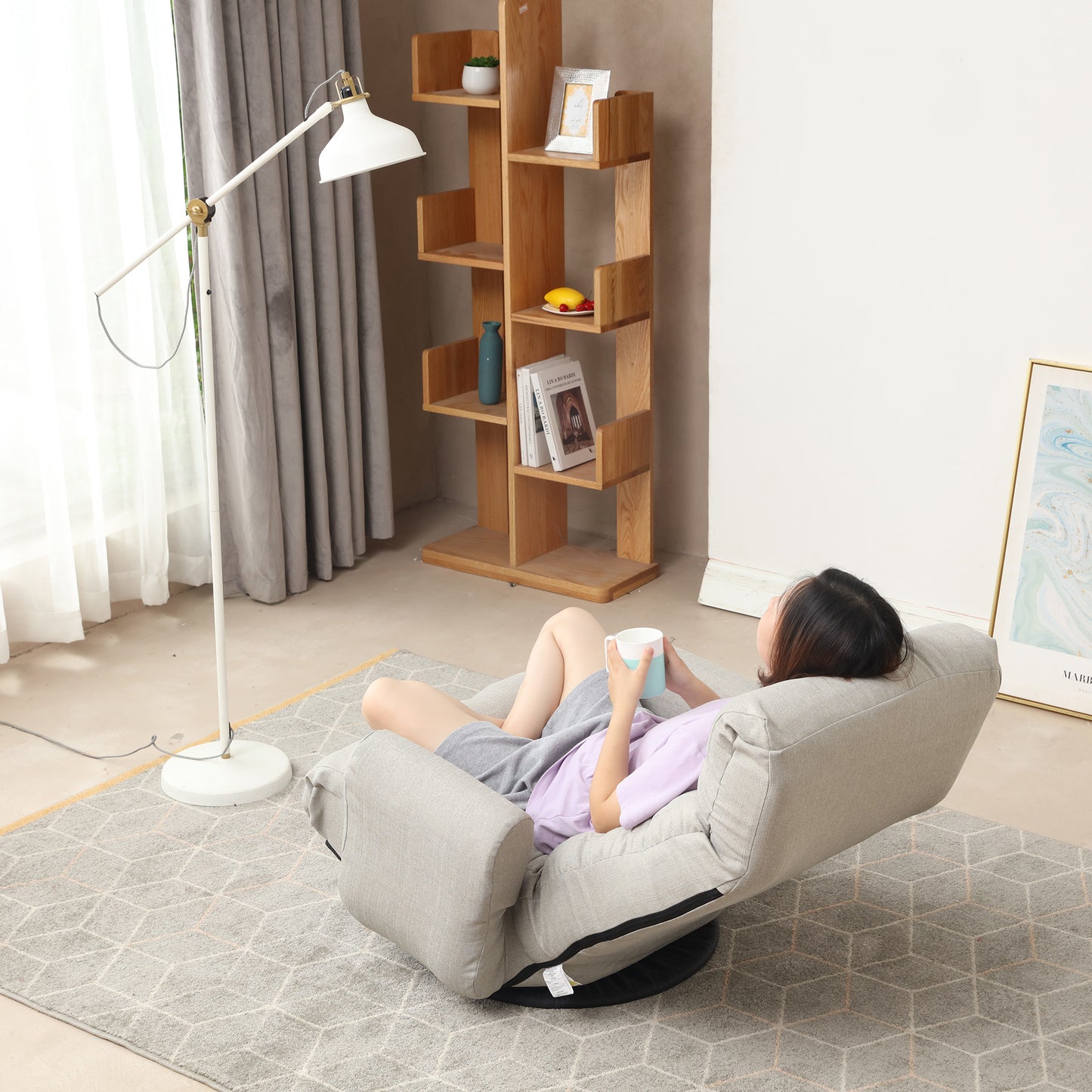 Tan linen swivel floor chair with plush cushioning for comfortable lounging
