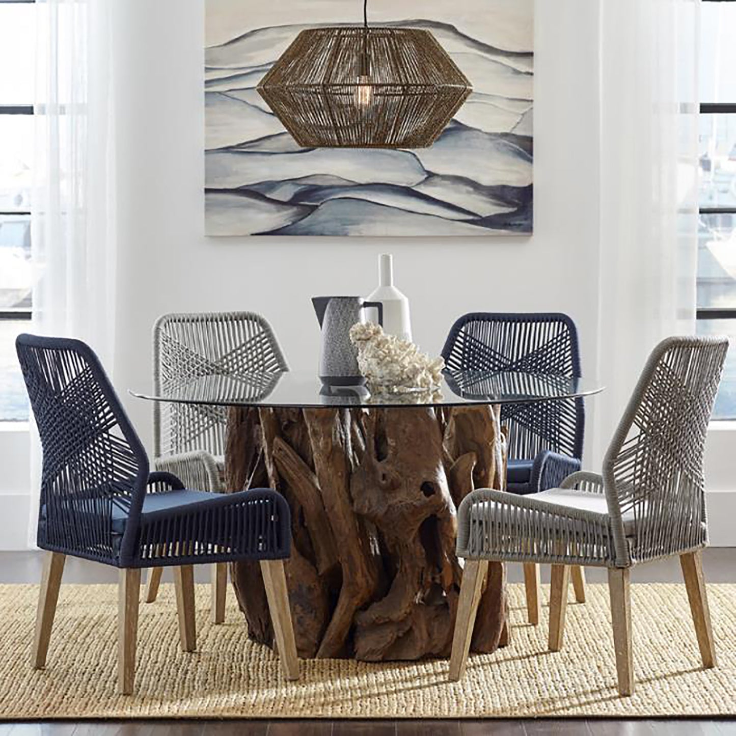 Navy woven dining chair with light wood legs and a plush seat cushion