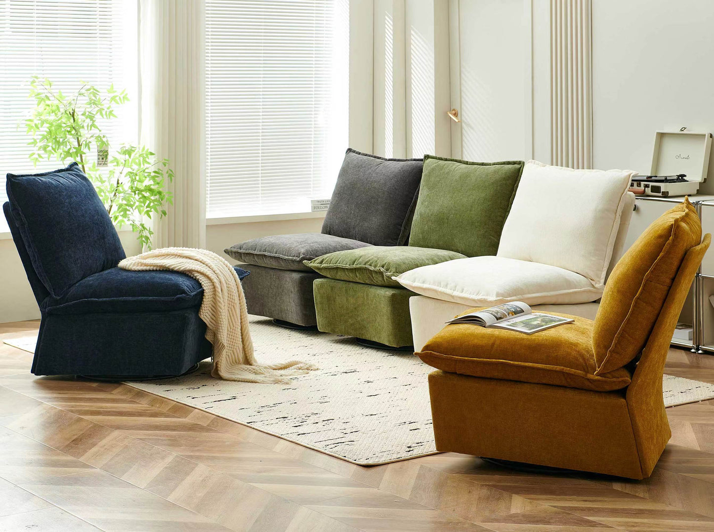 Plush navy blue modular armchair with a cream knit throw draped over its armrest