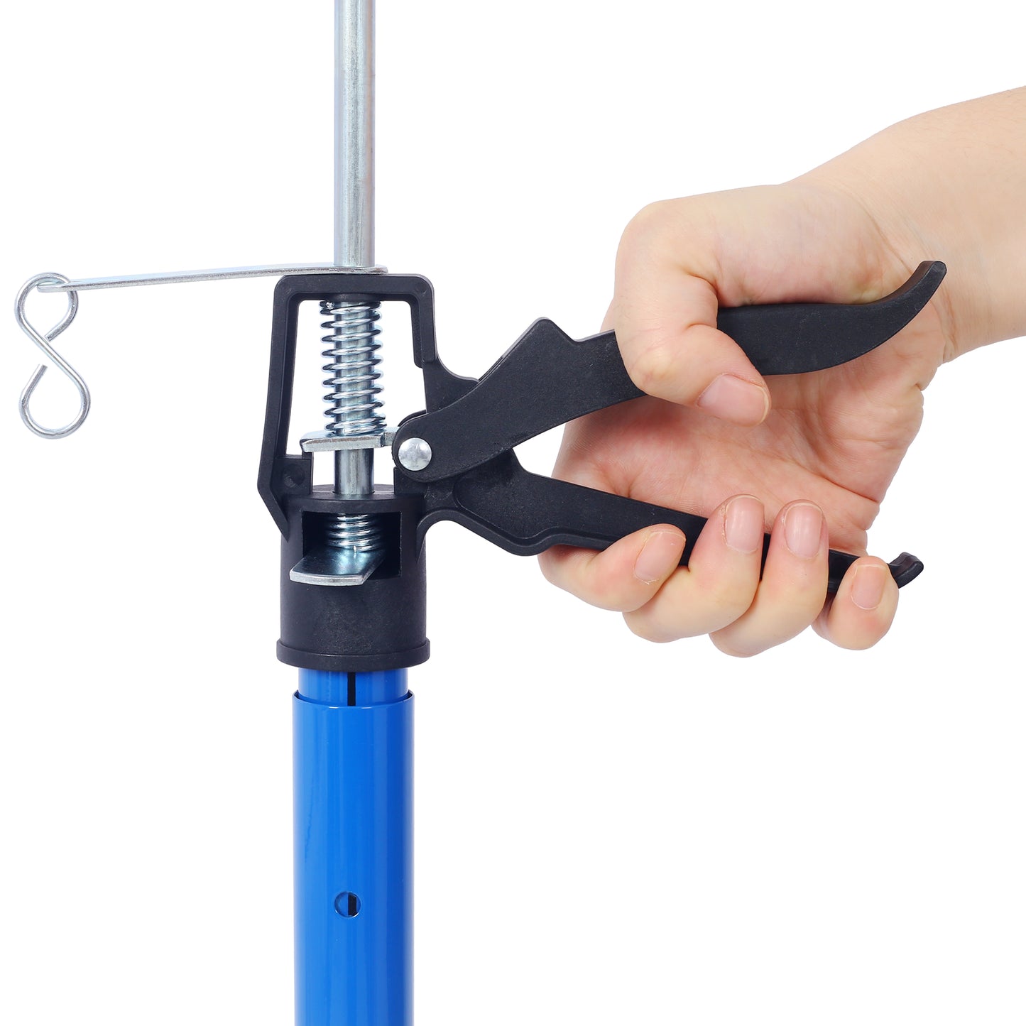 Closeup of a hand gripping a black plastic clamp on a silver metal pole with a blue base
