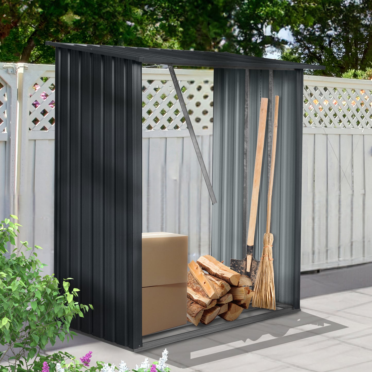 Dark gray metal garden shed storing firewood boxes a shovel and a broom