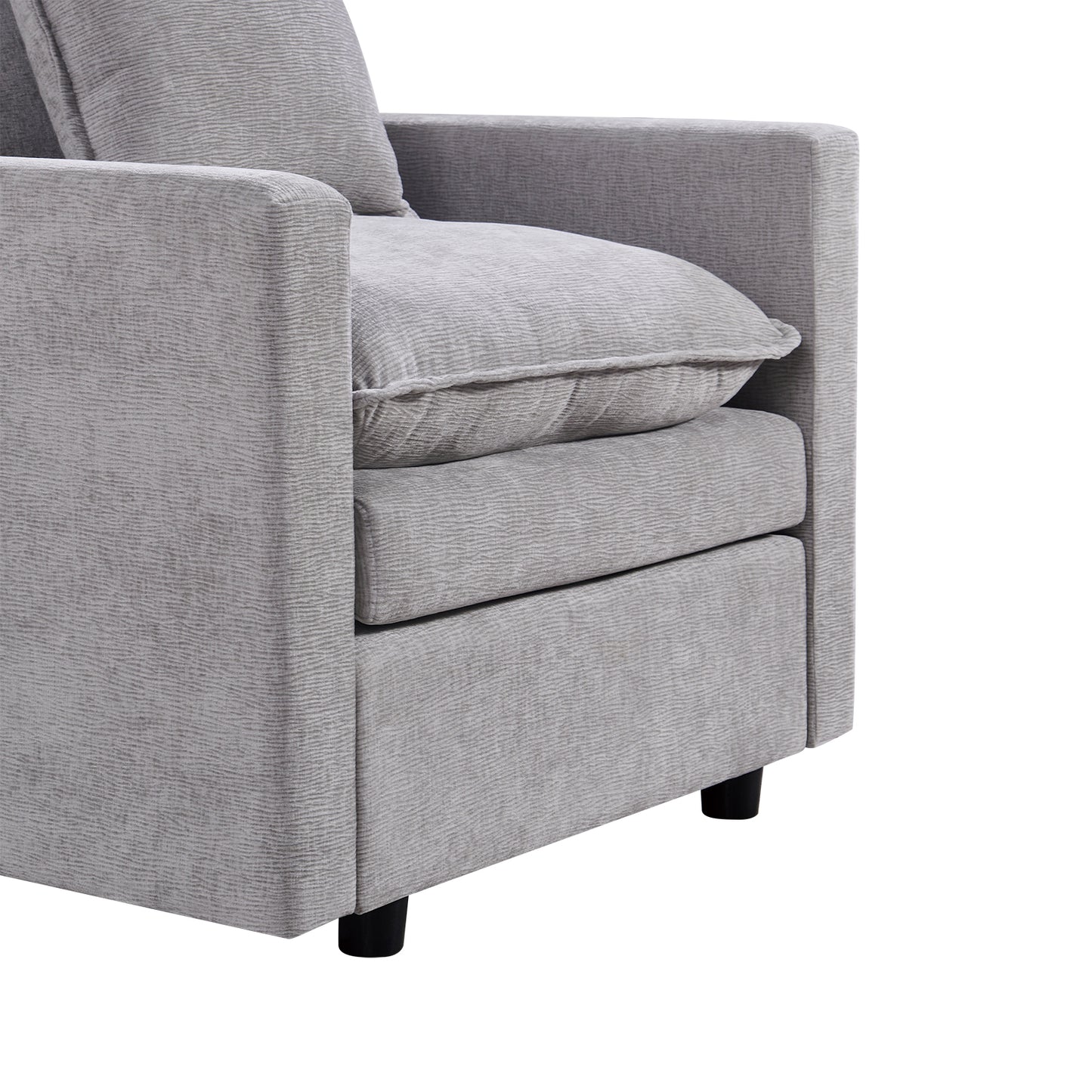 Closeup of a modern grey fabric armchair with textured upholstery and black legs perfect for living rooms