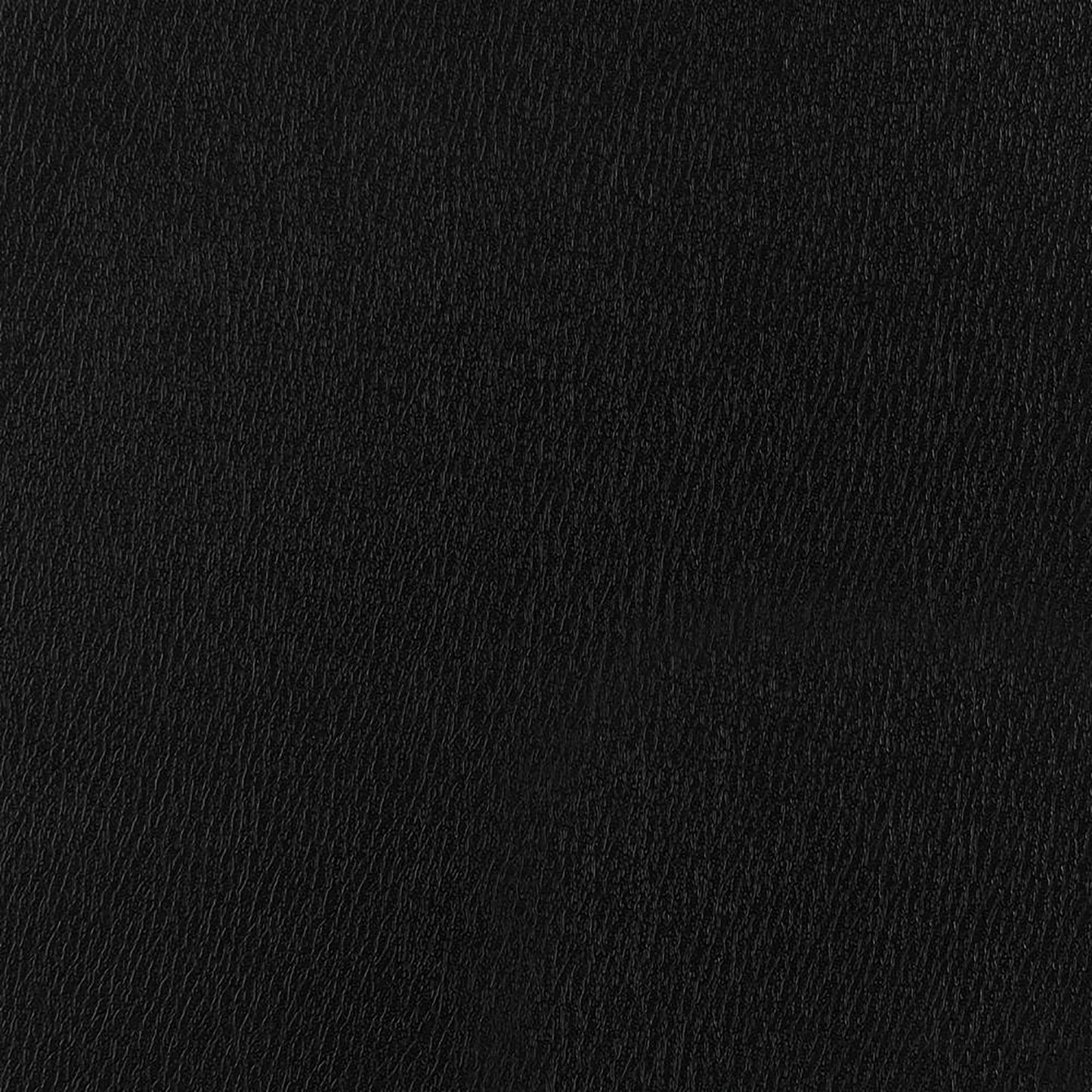 Closeup of a black faux leather texture ideal for upholstery and accessories