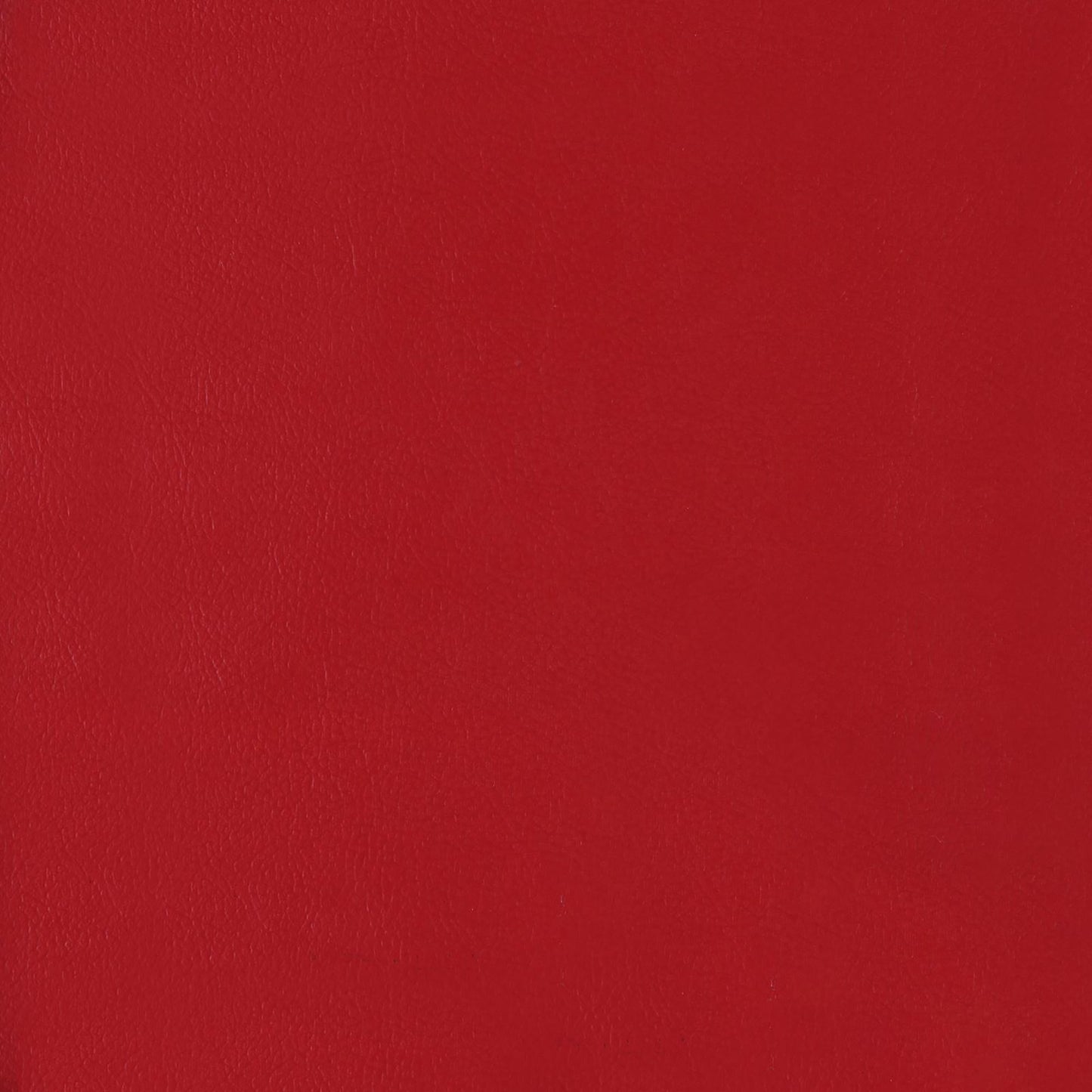 Textured red faux leather upholstery fabric sample