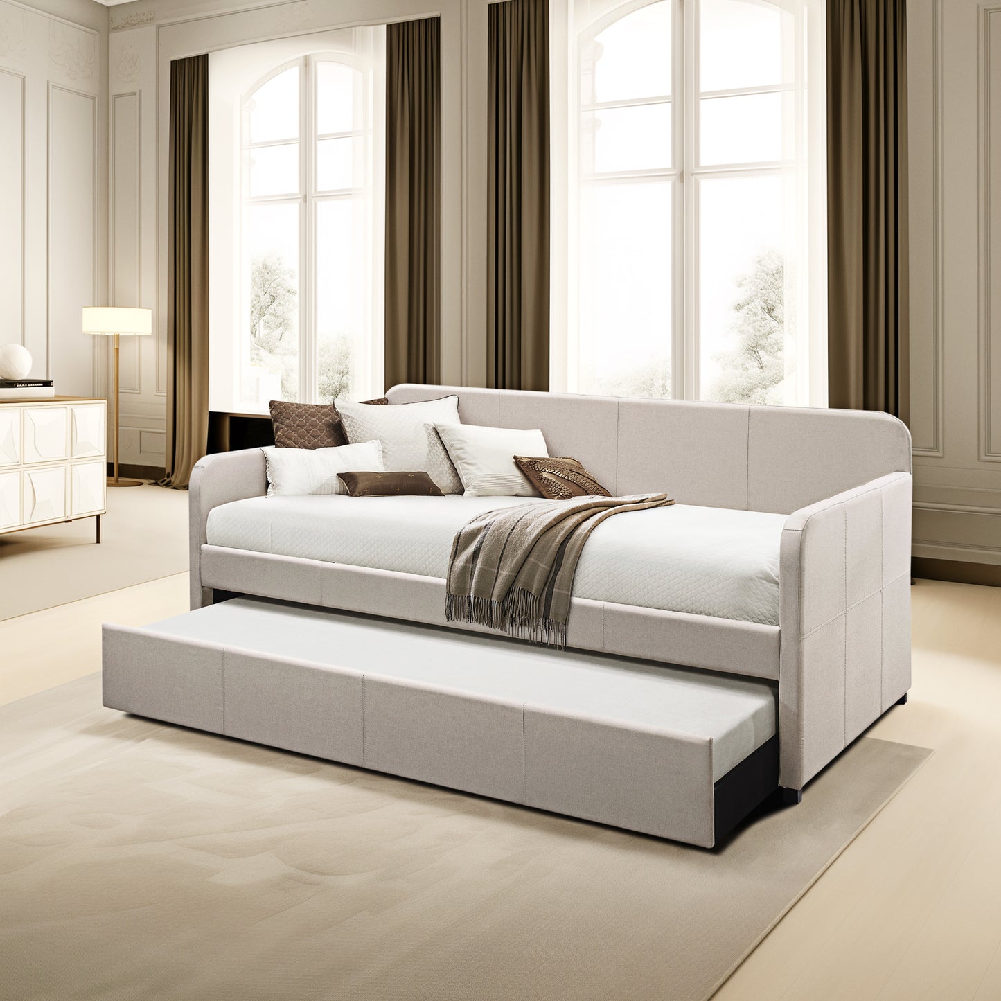 Light beige upholstered daybed with a pullout trundle perfect for guest rooms