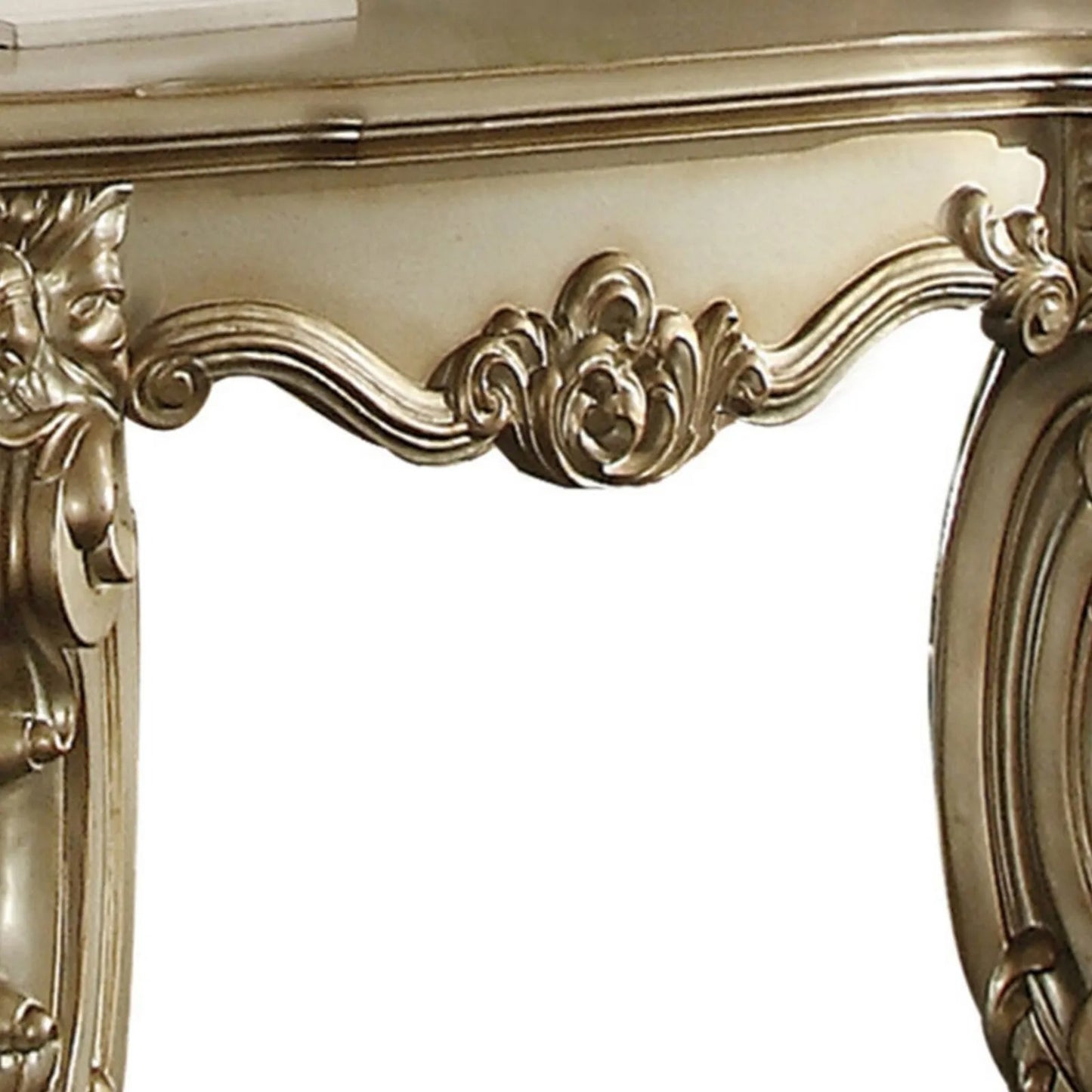 Ornate antique silver carved console table with detailed scrollwork and floral accents