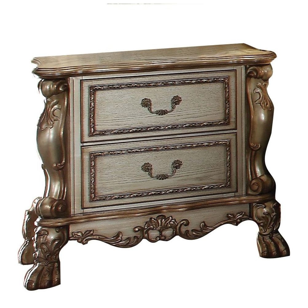 Antique white wooden nightstand with ornate bronze hardware and carved legs